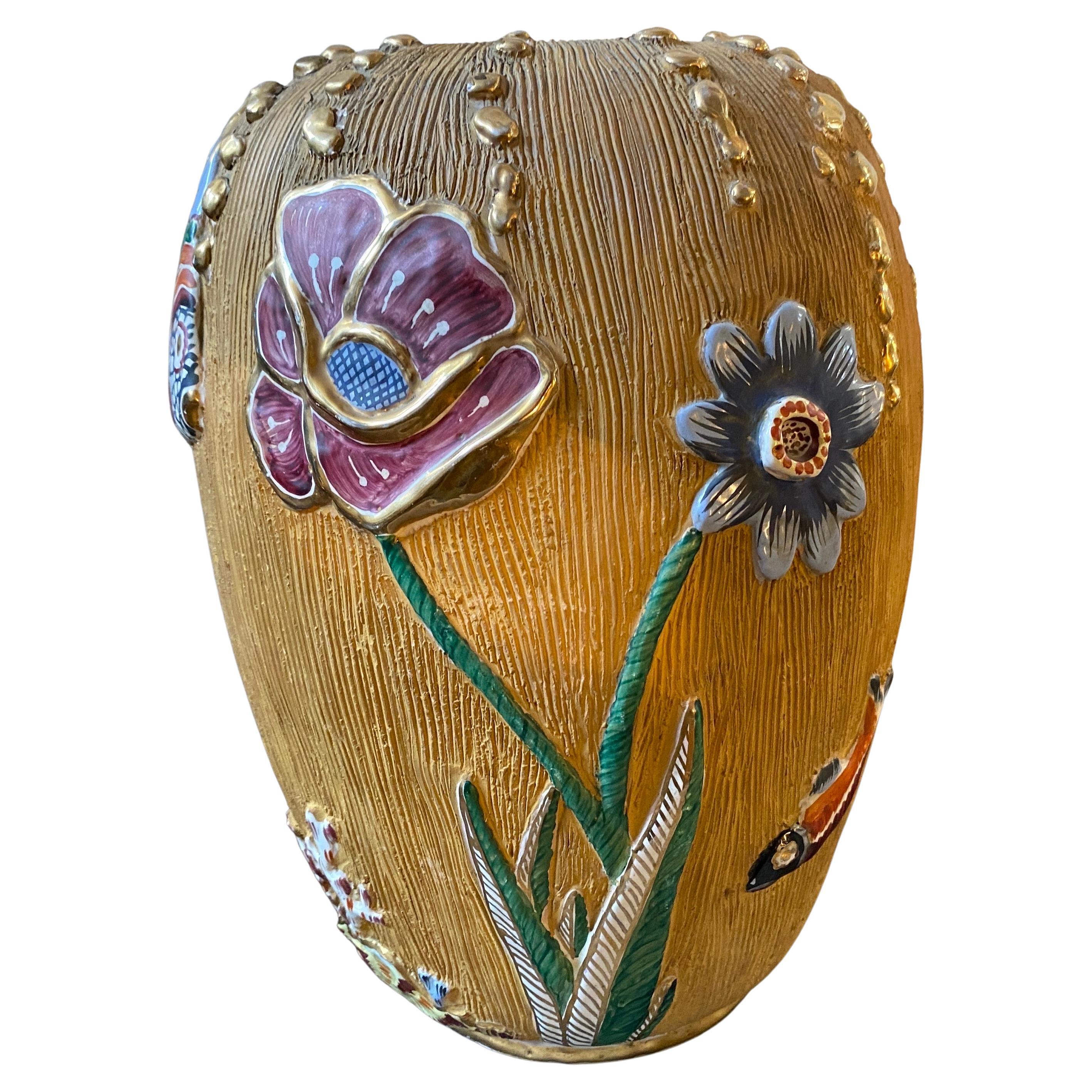 A Kitsch hand-painted ceramic vase designed and manufactured in Italy by Italo Casini, particular niche manufacturer established in Sesto Fiorentino in Tuscany. The vase it is decorated in relief with motifs of flora and fauna. It's in perfect