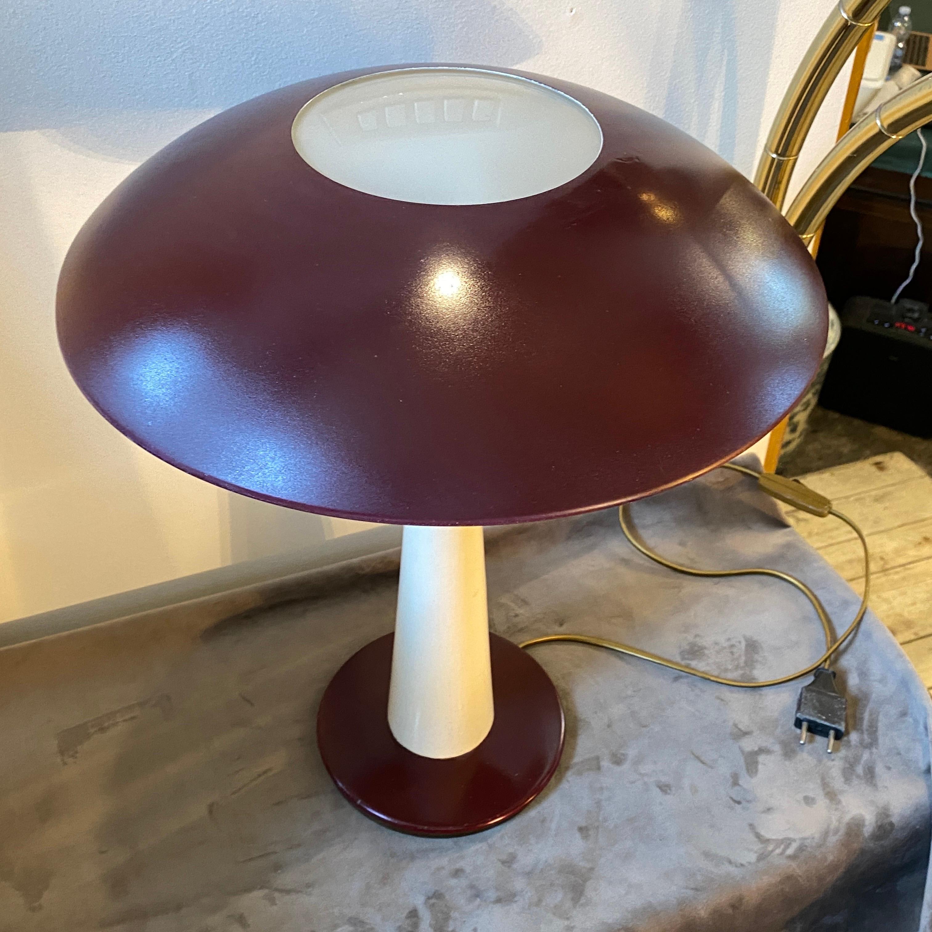 A burgundy and white metal and brass amazing table lamp designed and manufactured in Italy by Stilnovo. It's marked Stilnovo Italy on the bottom. It's in perfect working order and needs regular e27 bulb, it works both 110 and 240 volts.