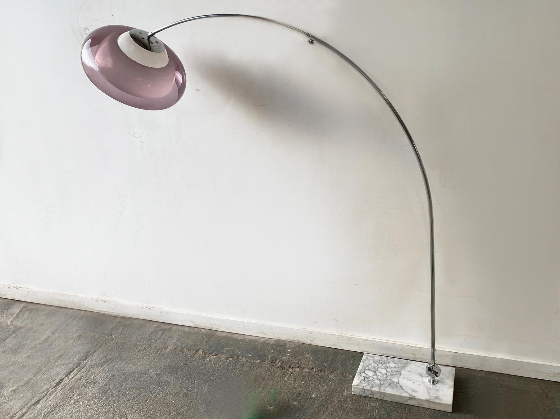 A mid century modern arched floor lamp made in Italy in the 1960s. Double shaded lamp head with one white and one lilac perspex dome. Very slender chromed steel arc, sits on a solid and heavy marble base. Angle adjustable at base, and arc pole is