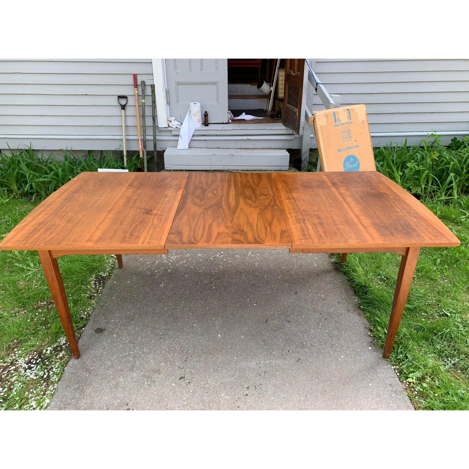 Gorgeous walnut table designed by Kipp Stewart. Table looks amazing and is very well made. Great Grain! With both leafs tables length: 102” leaf length is 22”.
