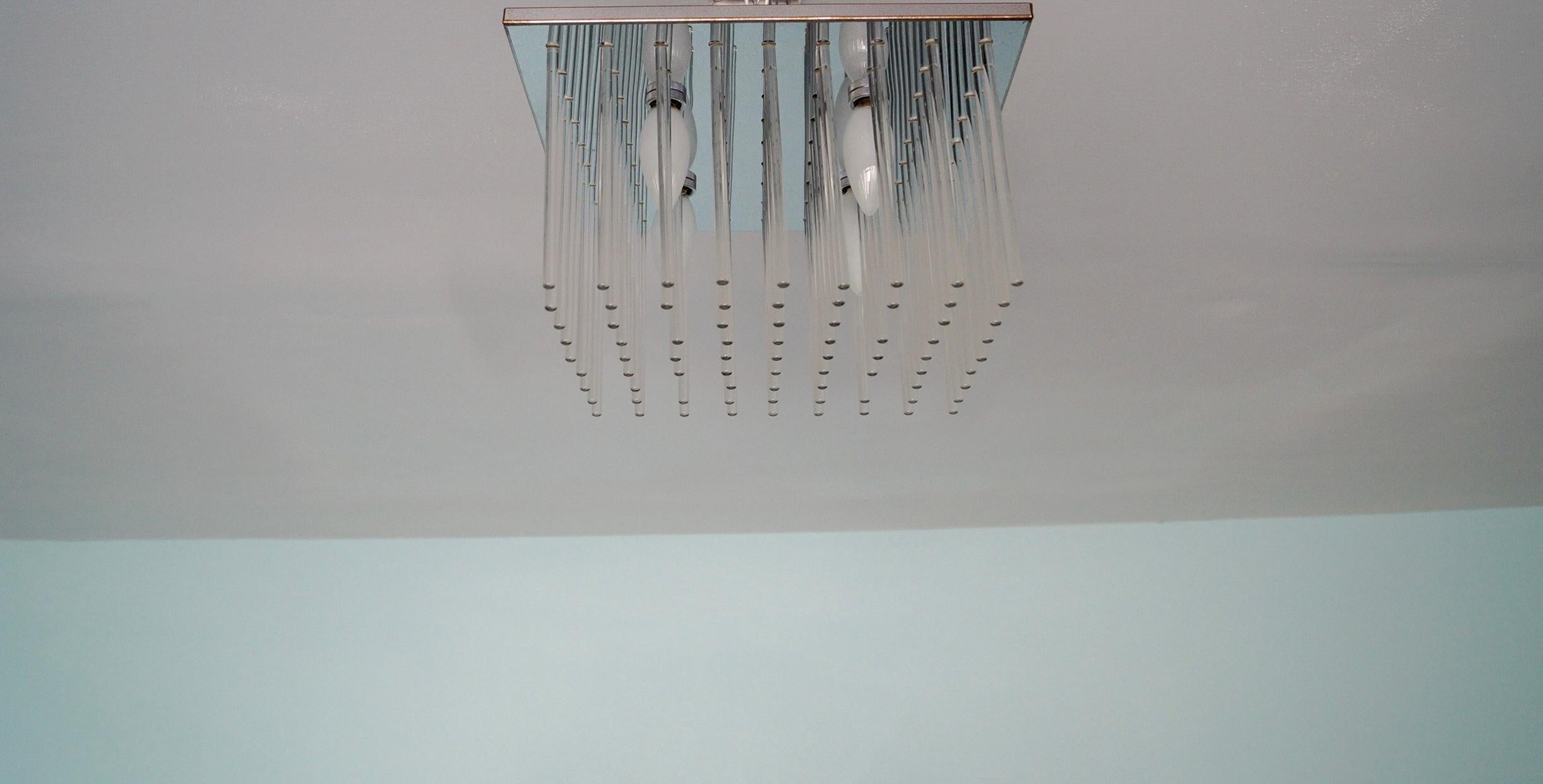 We have this gorgeous original 1960’s designer light fixture for sale. It was manufactured by the high-end lighting company Lightolier, and still retains the sticker. It has different materials beautifully incorporated, and is in perfect working