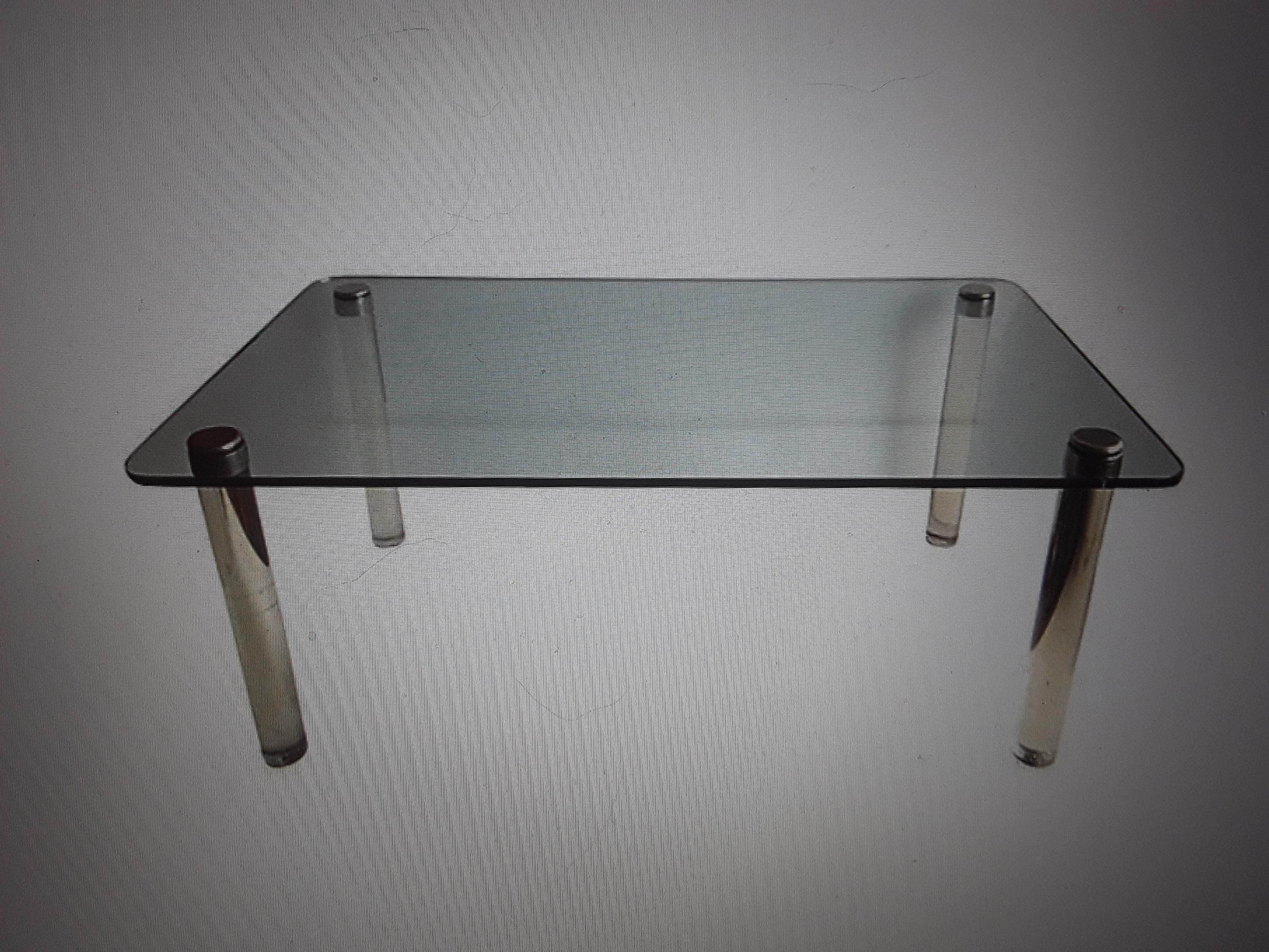 1960's Mid Century Modern Lucite and Glass Dining Table. Glass top with heavy lucite leg posts topped with chrome caps.