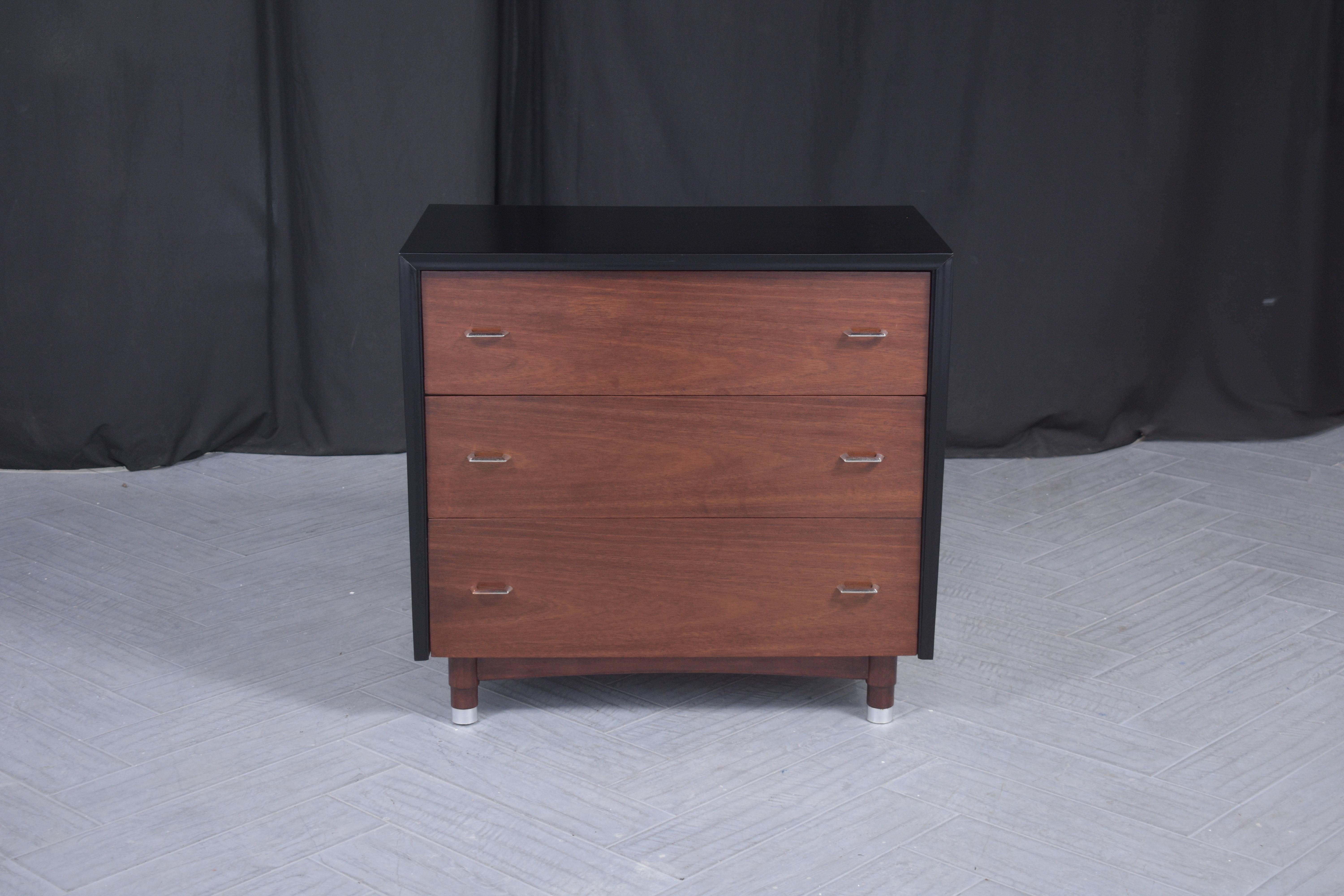 Step into the world of refined vintage style with our beautifully restored Mid-Century Modern Dresser, a hallmark of the iconic 1960s era. Artisans have painstakingly revived this dresser, skillfully handcrafting it from premium mahogany wood to