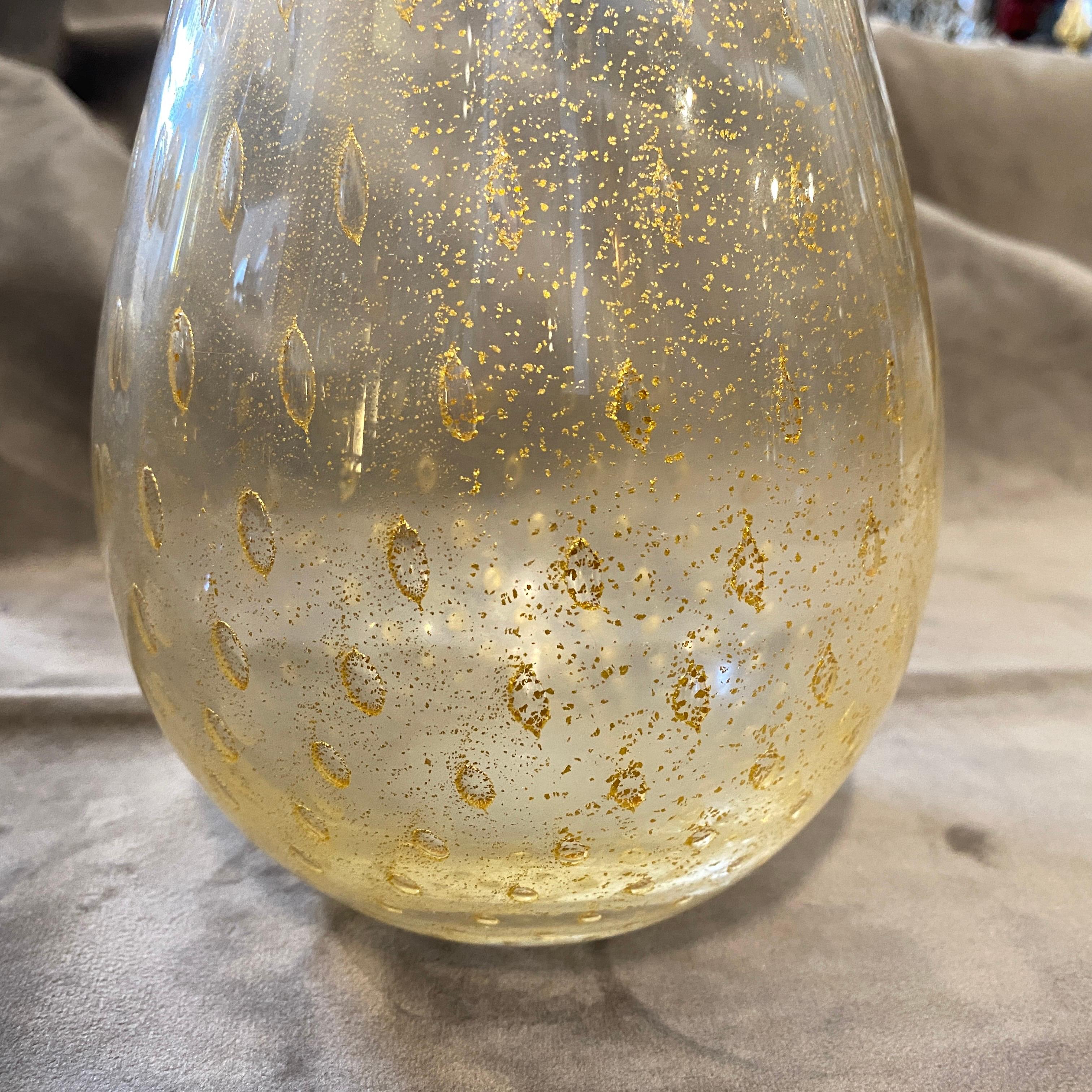 A transparent and gold bullicante murano glass vase designed and manufactured in Venice in the Sixties, pure gold inside the glass gives it a superb look. Totally hand-crafted, it's in perfect conditions. This vase it's a beautiful and highly
