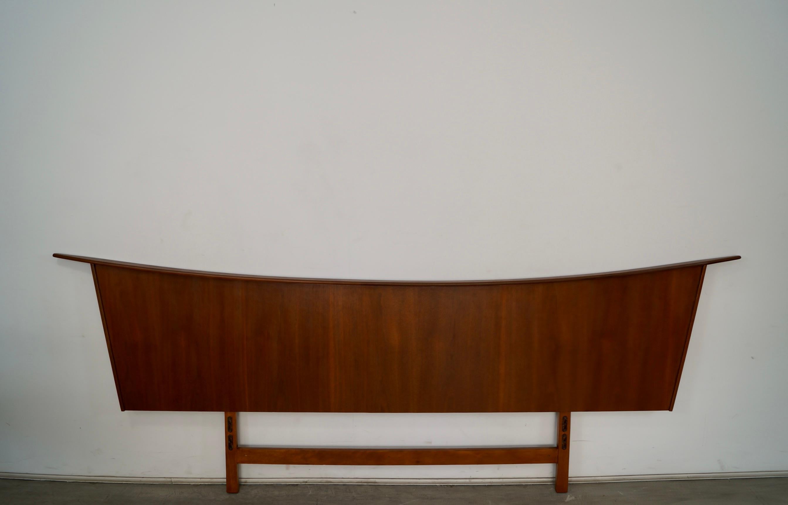 Vintage original Midcentury Modern headboard for sale. In the manner of George Nakashima, and has been professionally refinished. Can be used for different mattress sizes from full size, queen size, or king size. It's in excellent condition, and