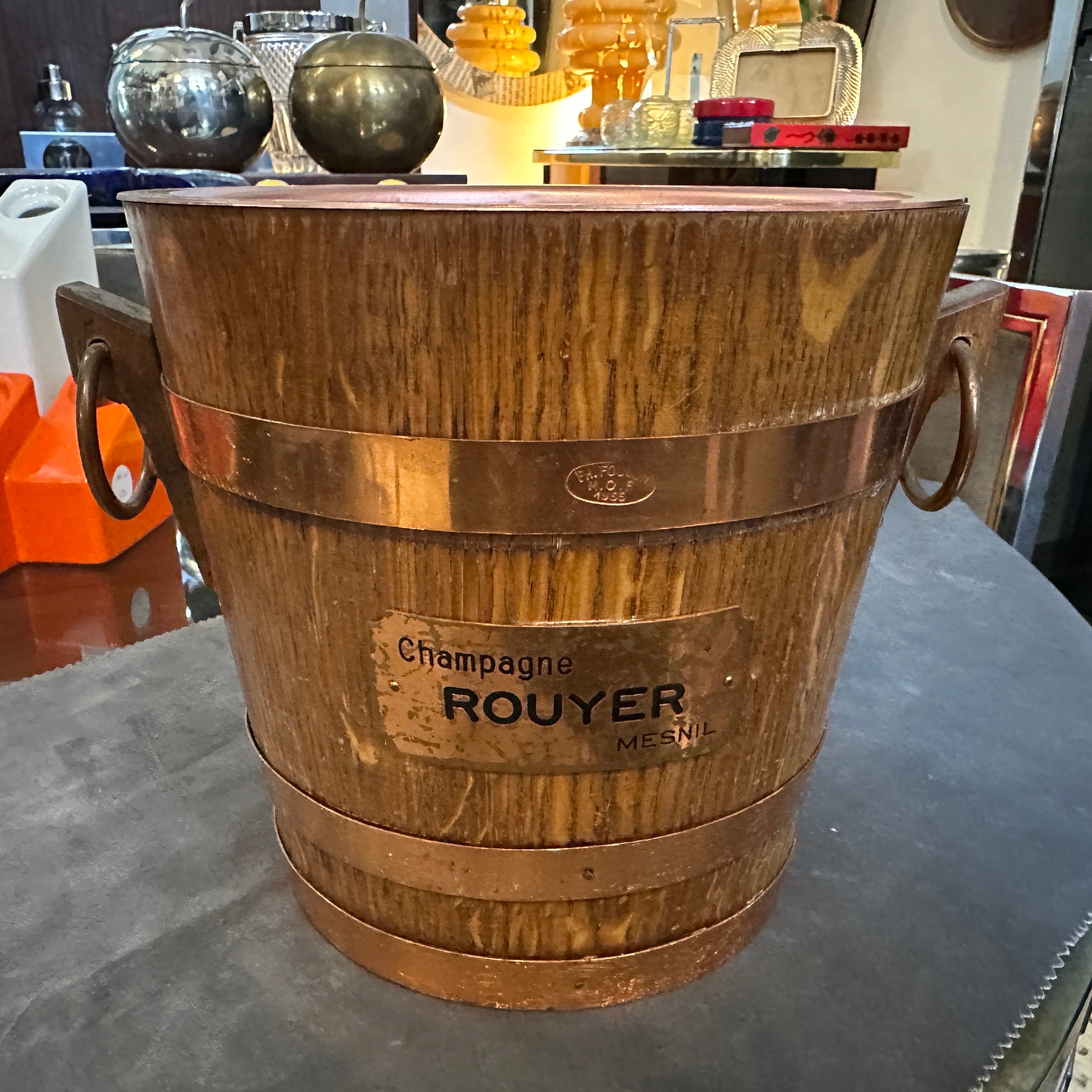 An amazing oak and copper wine cooler hand-crafted in France in the Sixties for the Champagne Rouyer of Mesnil in France, it's in original condition with normal signs of use and age, marked on the front  It exhibits characteristics of the Art Deco