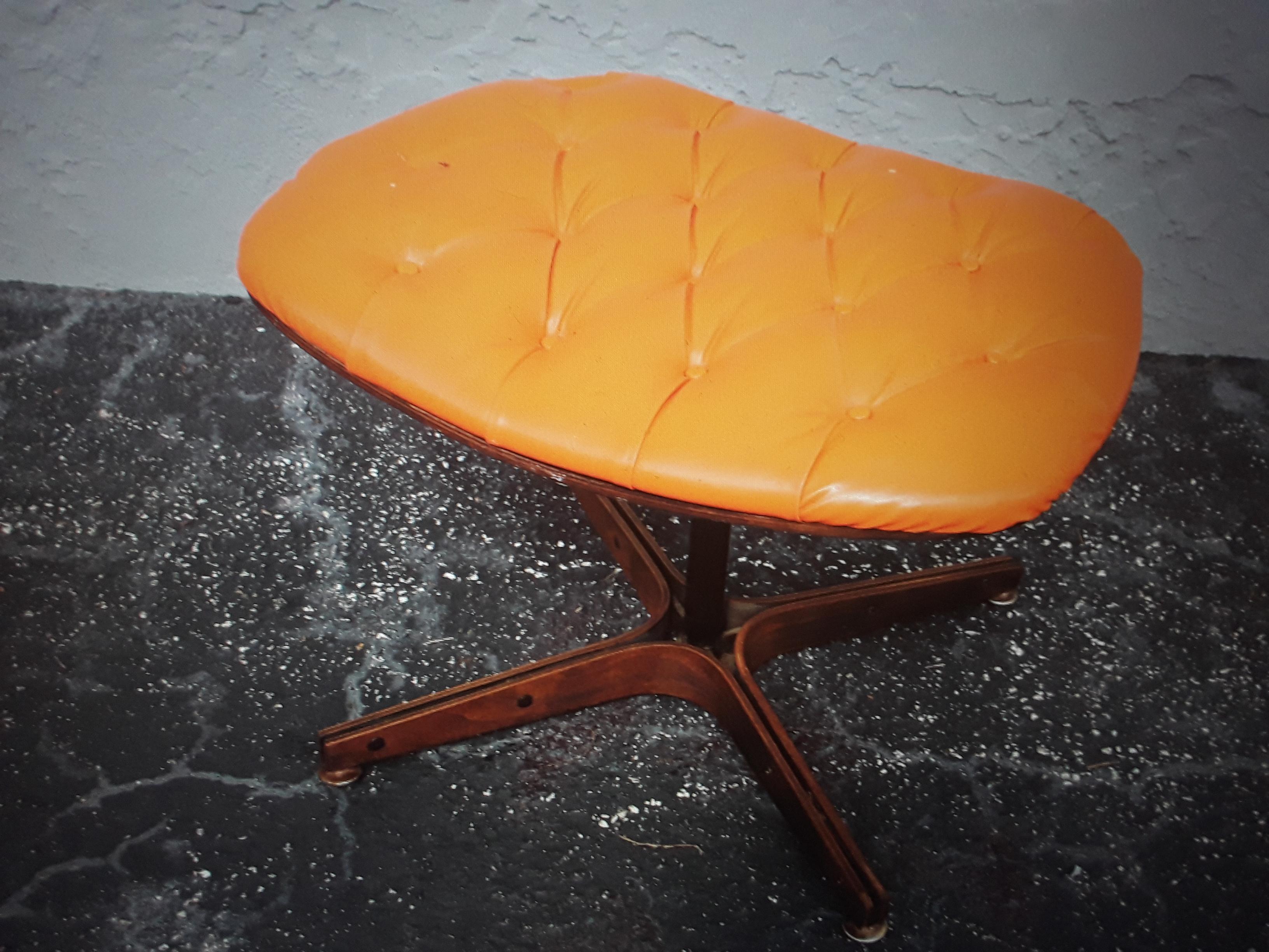 1960's Mid Century Modern Orange Tufted Vinyl Foot Stool. I found this piece interesting. I love the color.