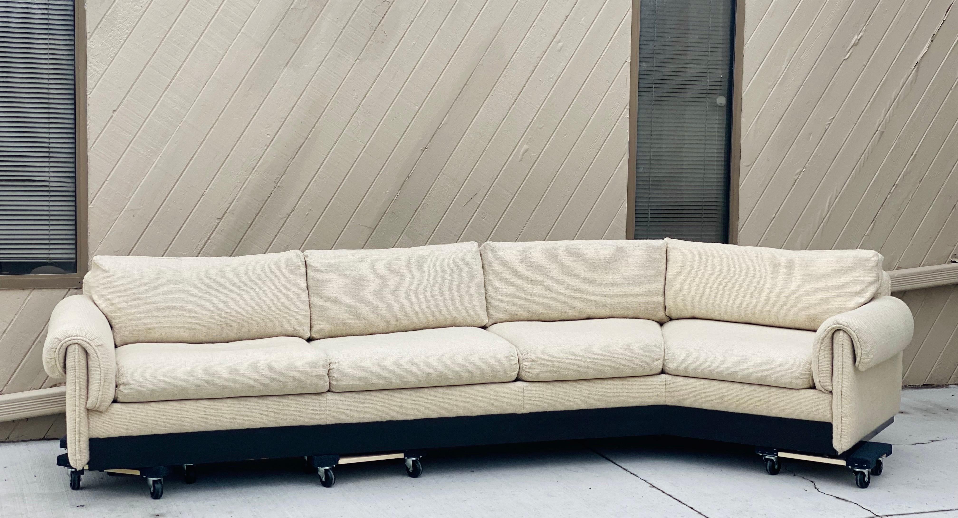 We are very pleased to offer a beautiful, modern sectional, circa the 1960s. Clean lines and an open attitude meet casual comfort on this one-piece sectional. Comprising a long seating area with a right facing angle, this piece provides a casually