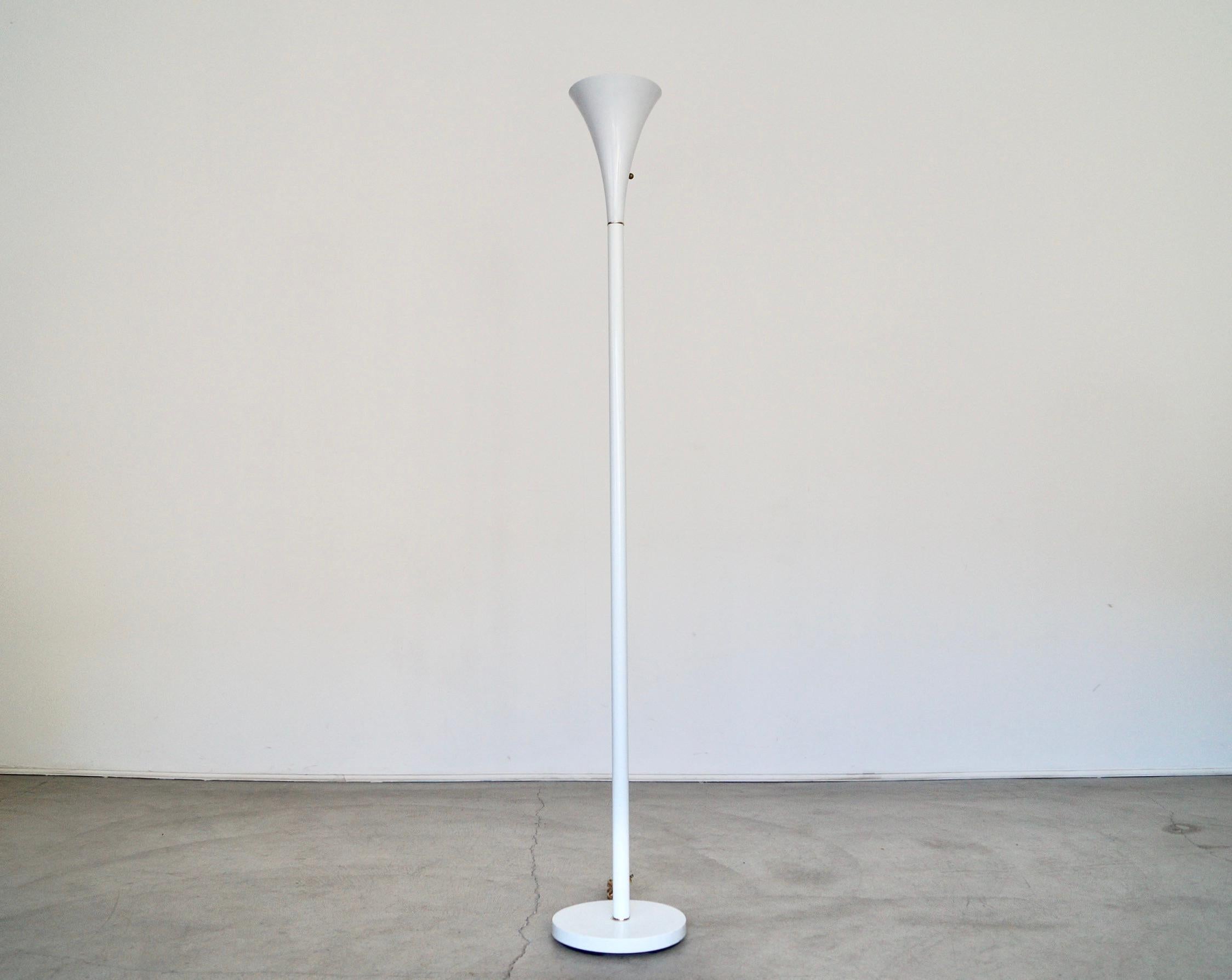 Beautiful vintage Mid-century Modern floor lamp for sale. Great trumpet design in white with brass accents. Has a brass ring and a brass knob. Manufactured by Plymouth Harlee and in the manner of Laurel Lighting. Excellent condition, and in great