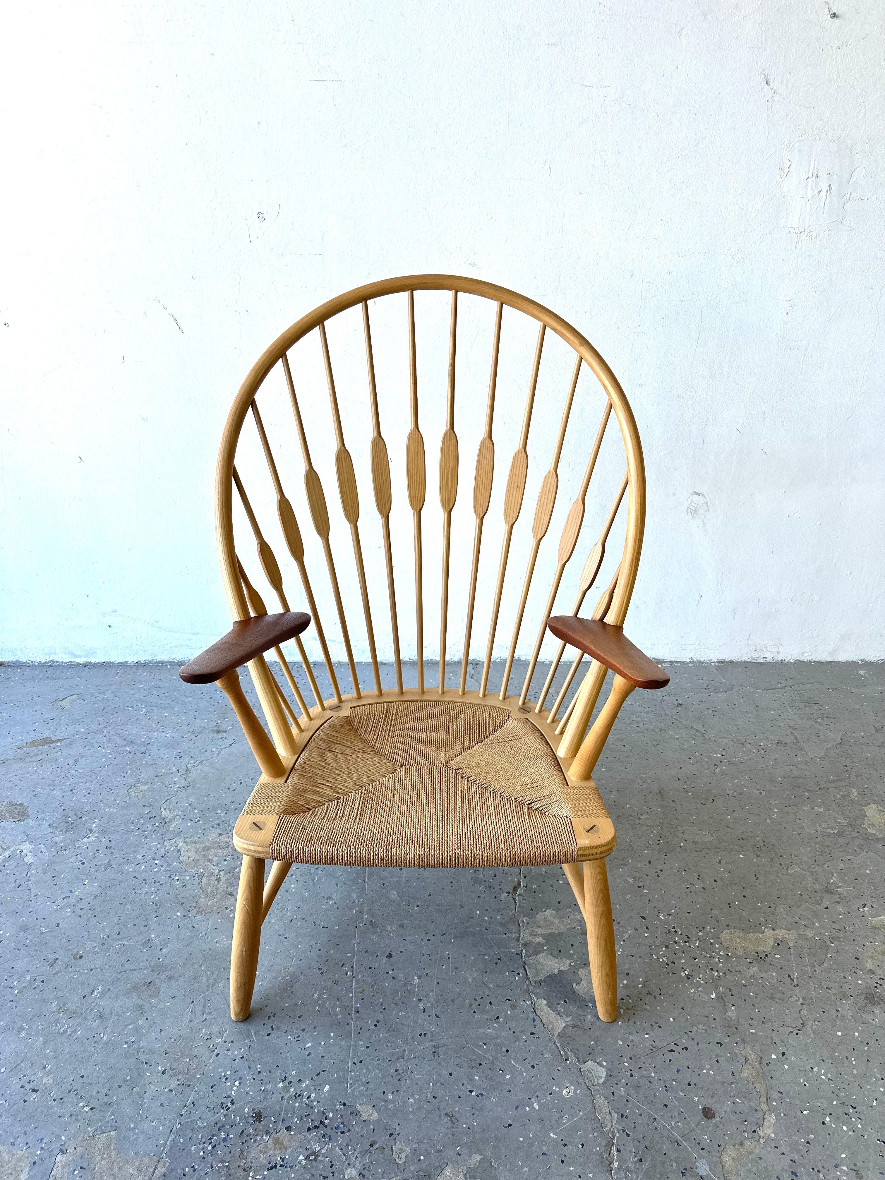 A Mid-Century Modern PP550 ‘Peacock’ chair designed by Hans Wegner in 1947 for Johannes Hansen.

Modeled after a traditional American Windsor chair, Hans Wegner’s Peacock chair strips the form to reveal its construction while retaining aesthetic,