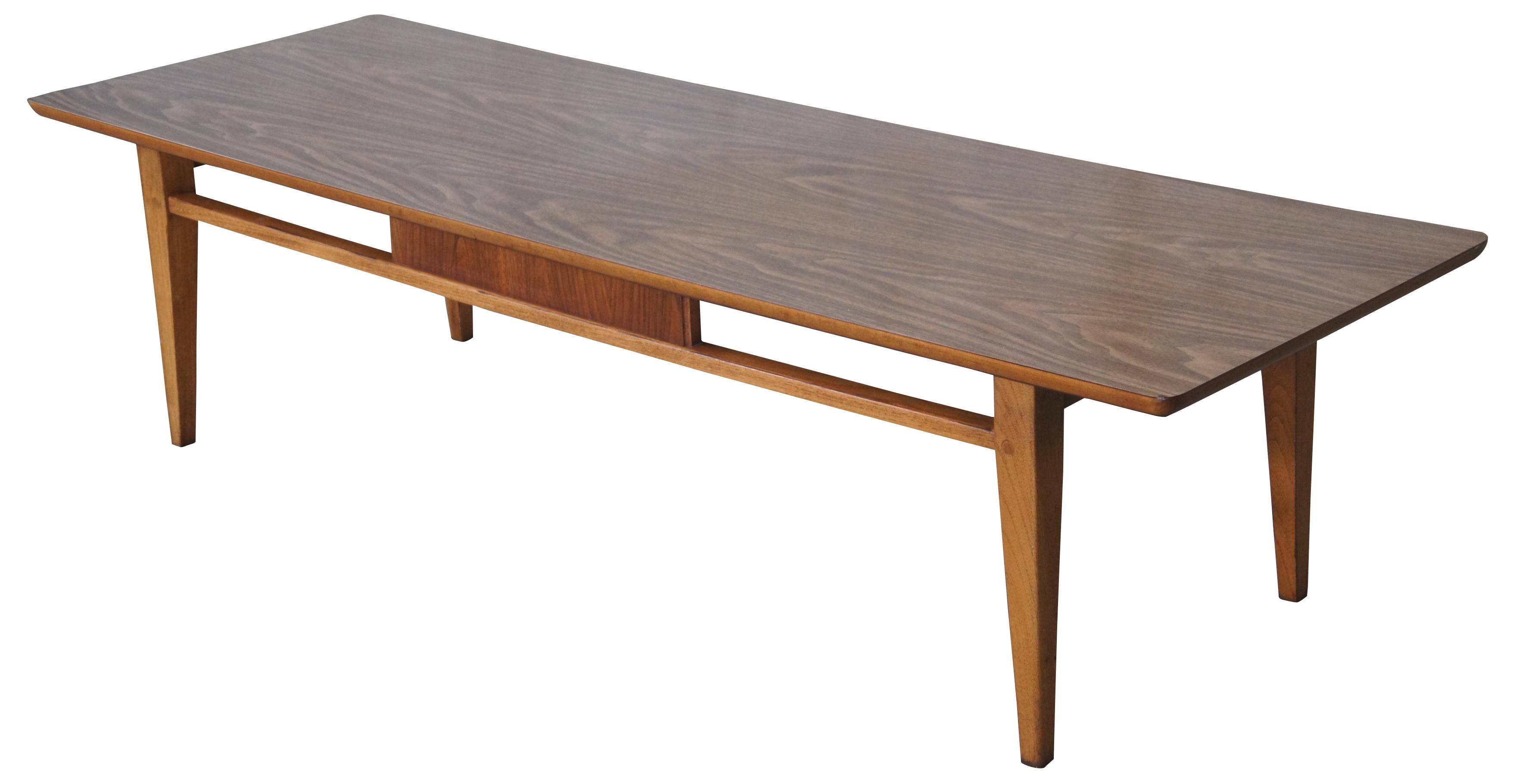 Vintage 1960s Danish inspired coffee table by Lane Furniture. Rectangular form with sleek deisgn made of walnut and formica top. Style no 1021-01, manufactured on February 23, 1963. Measure: 60