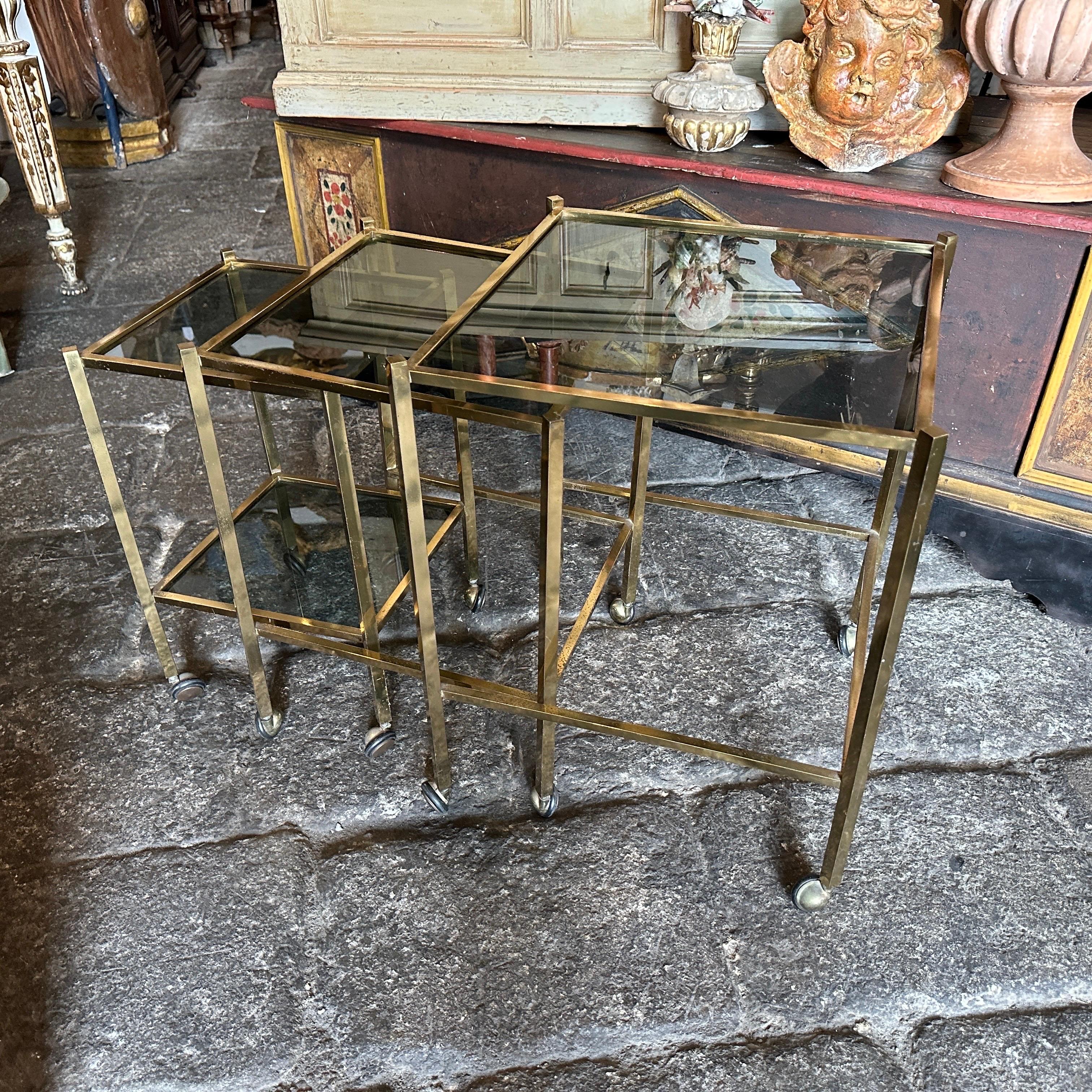 Italian 1960s Mid-Century Modern Set of Three Brass and Smoked Glass Nesting Tables For Sale