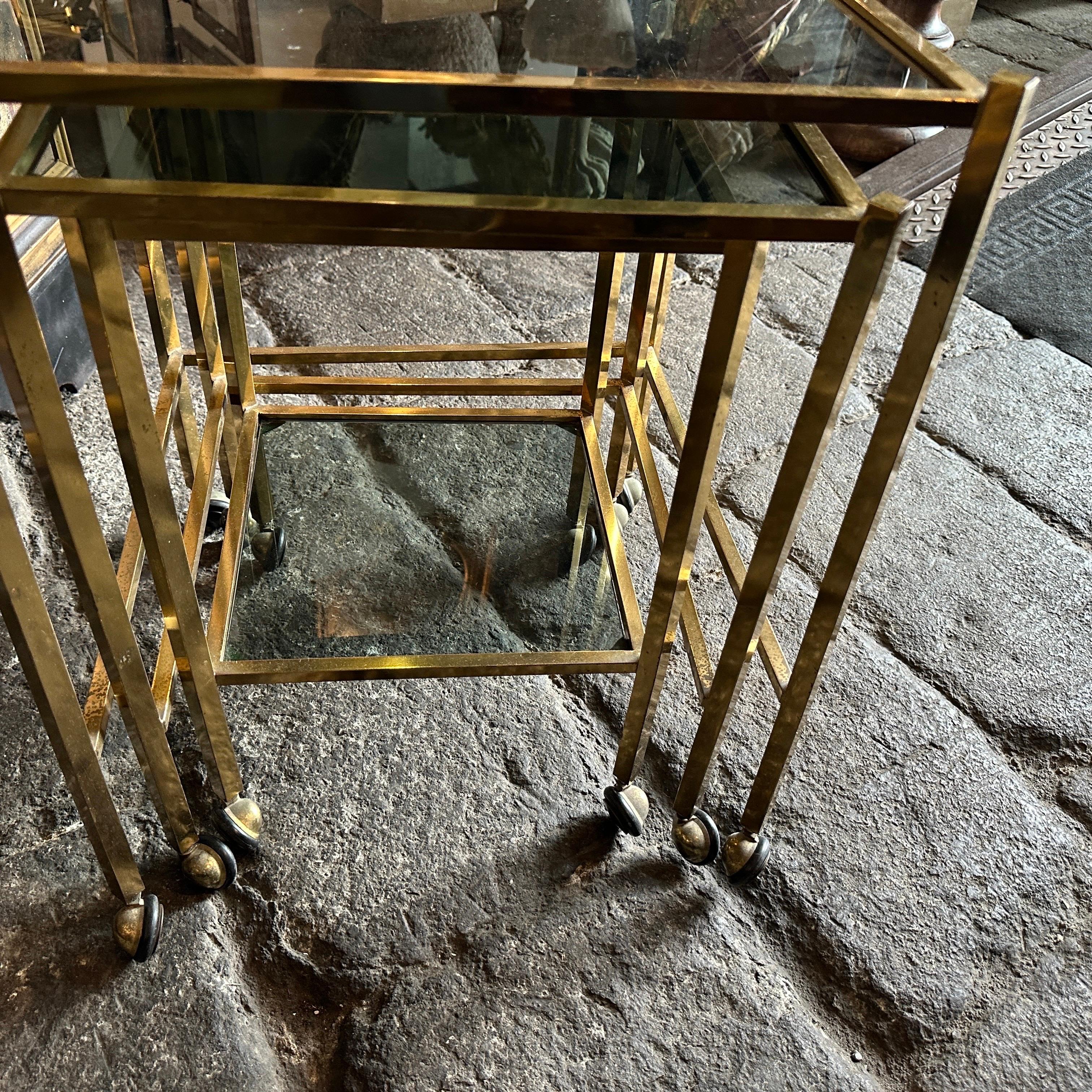 Metal 1960s Mid-Century Modern Set of Three Brass and Smoked Glass Nesting Tables For Sale