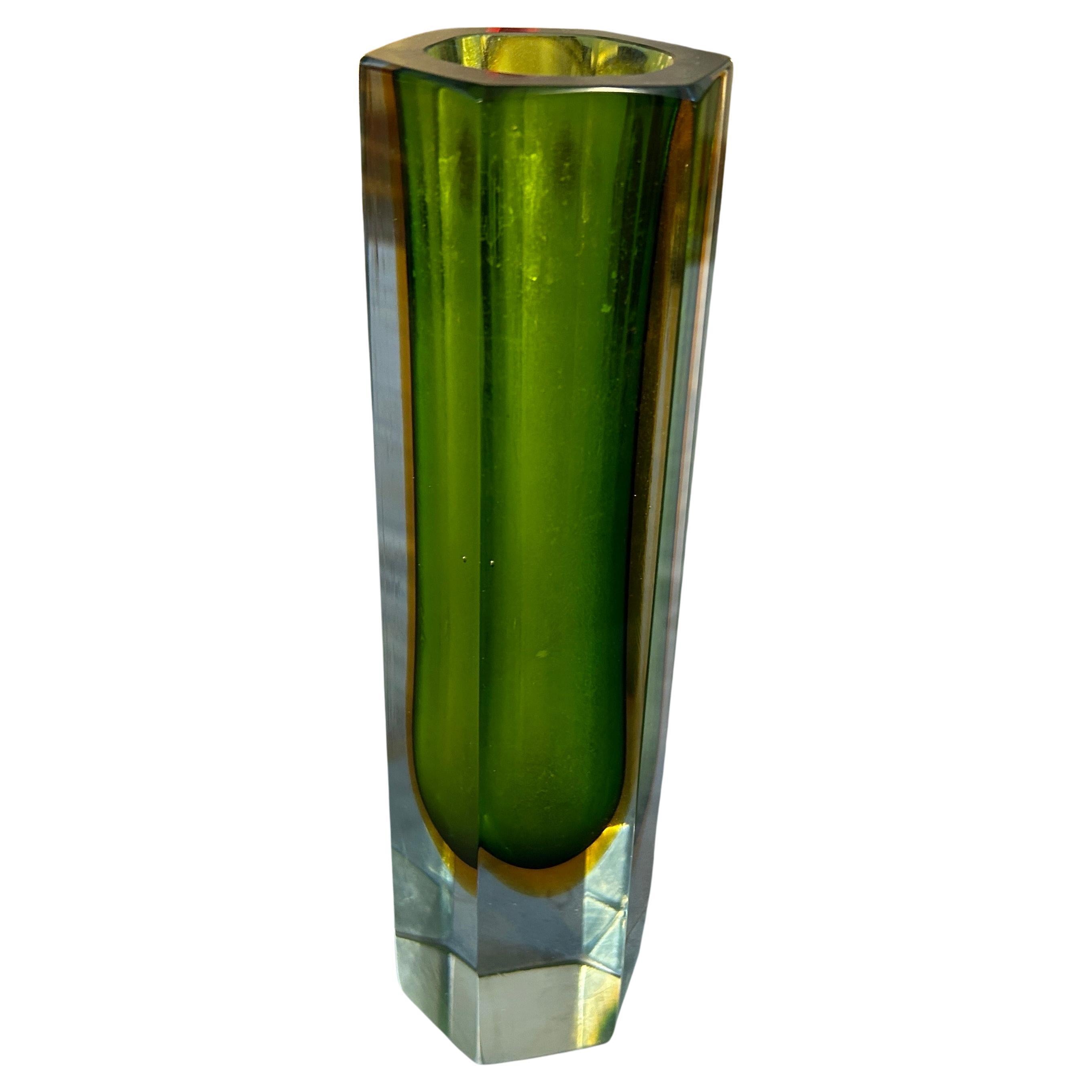 A green and yellow hexagonal heavy Murano glass vase, manufactured in Venice by Mandruzzato in the sixties, is in very good condition. The vase is a stunning example of Italian craftsmanship and design. Characterized by its unique shape, vibrant