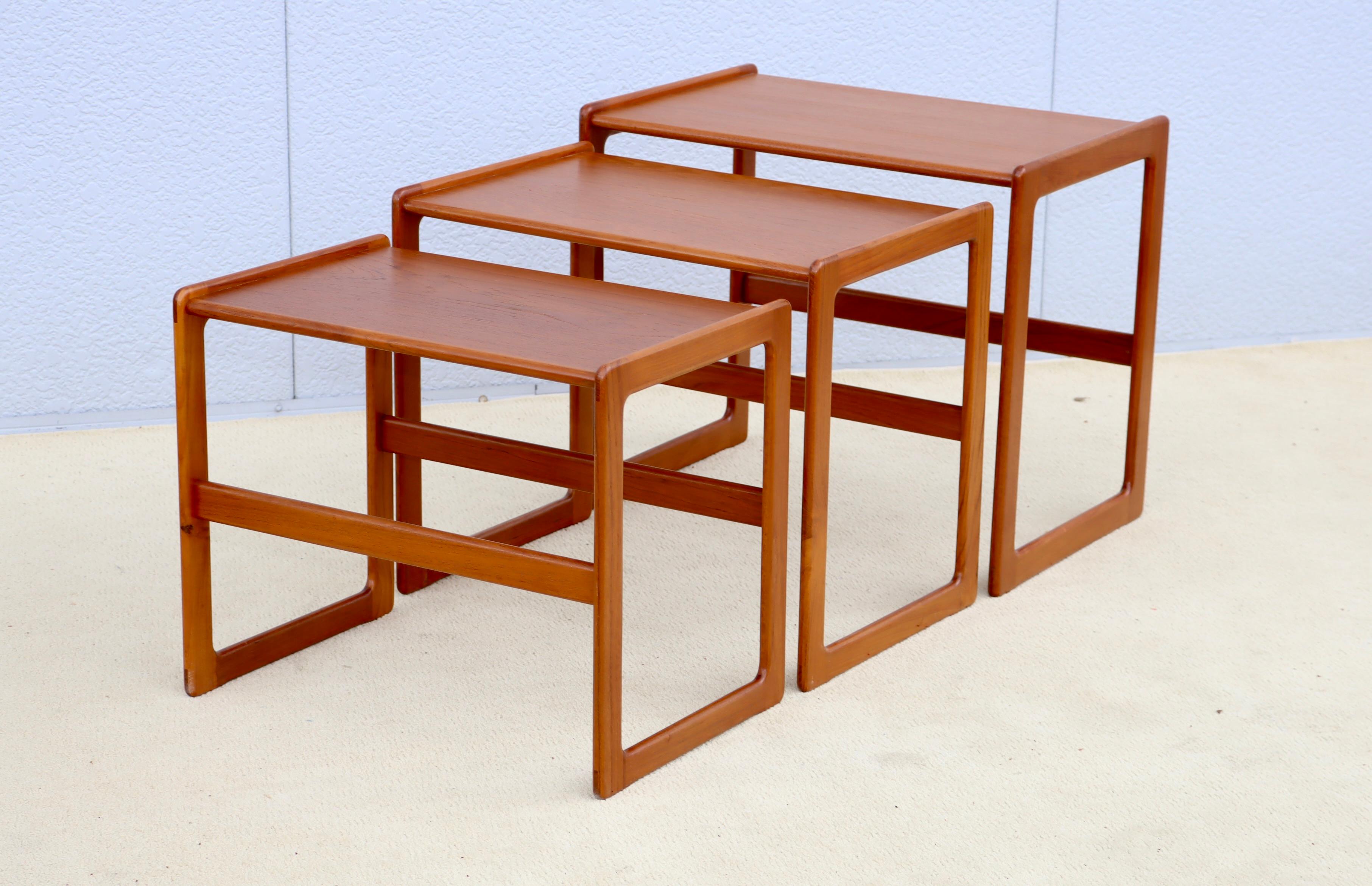 Amazing set of 3 1960's mid-century modern Danish teak nesting tables, lightly restored with minor wear and patina due to age and use.

Medium size table measurements: W 21.5 depth 14.5 height 18.25
Small table measurements: W 20.25 depth 13.5