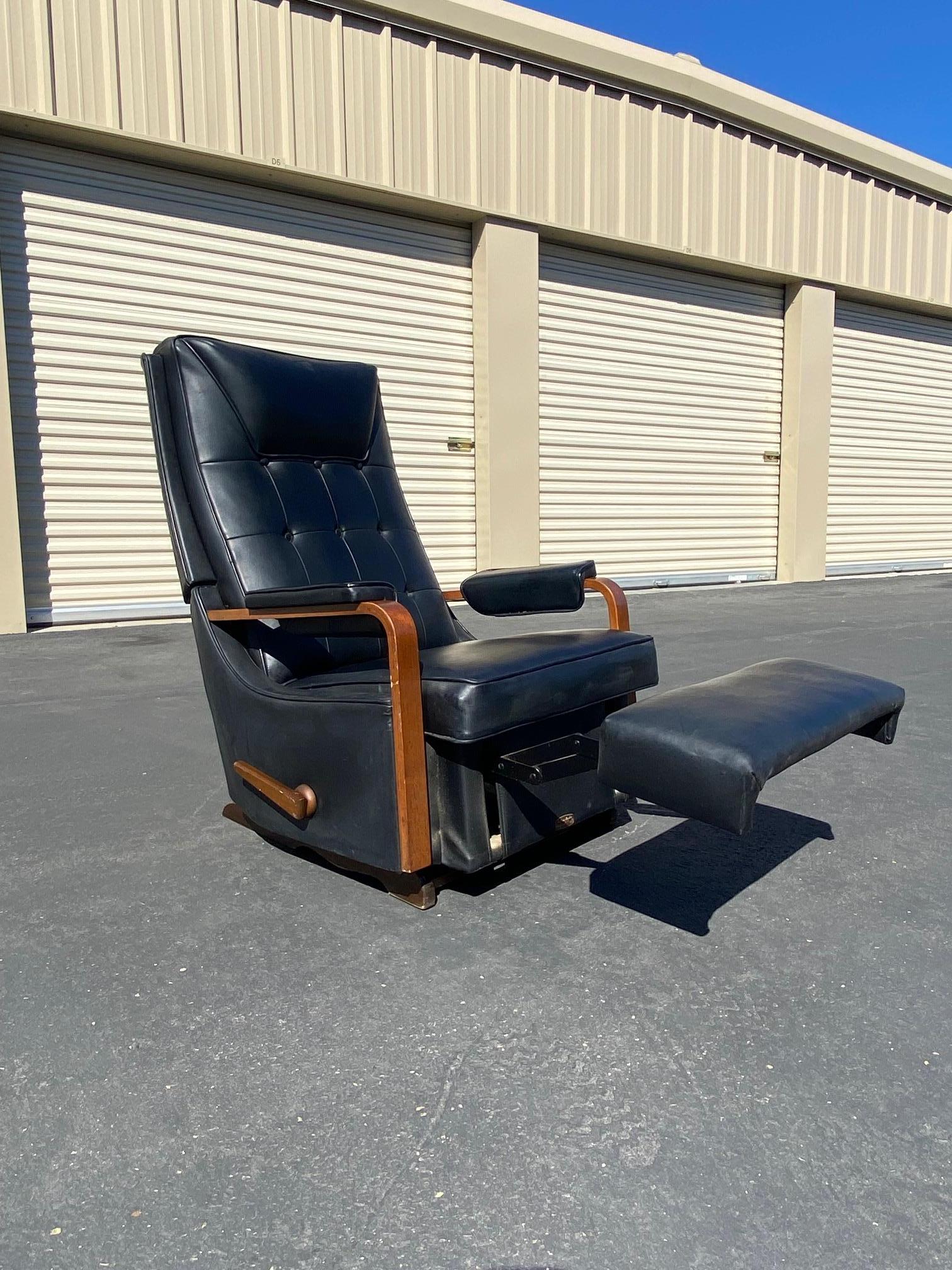 Stunning original classic leather mid century Recliner with walnut trim from La-z-boy. This beautiful piece is both timeless in design and modern in appeal. Does have a slit/tear on one of the armrests. Marks and scratches in the walnut trim