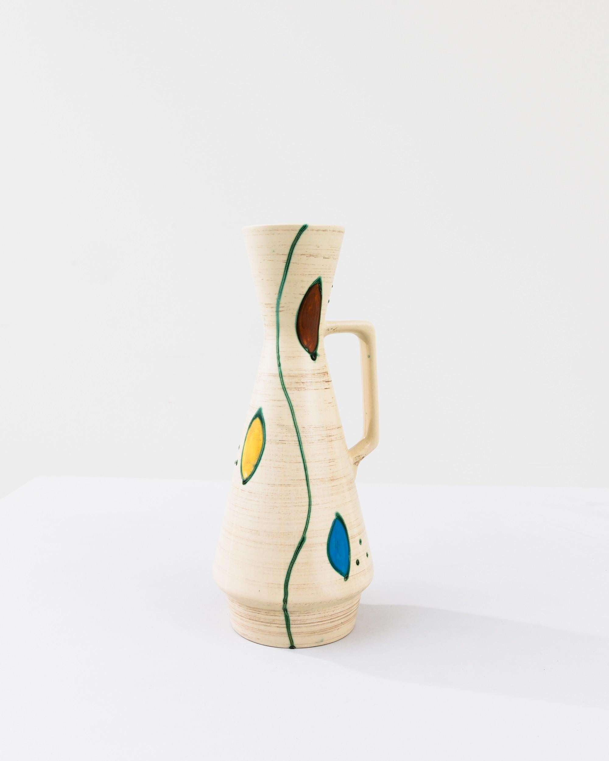 A ceramic vase from mid-20th century Germany. Neither large nor small, this studio made pot reflects the hand-held, and the handmade; the tactility of process and the artist's vision– realized on the potter’s wheel. A brushed umber tone enforces the