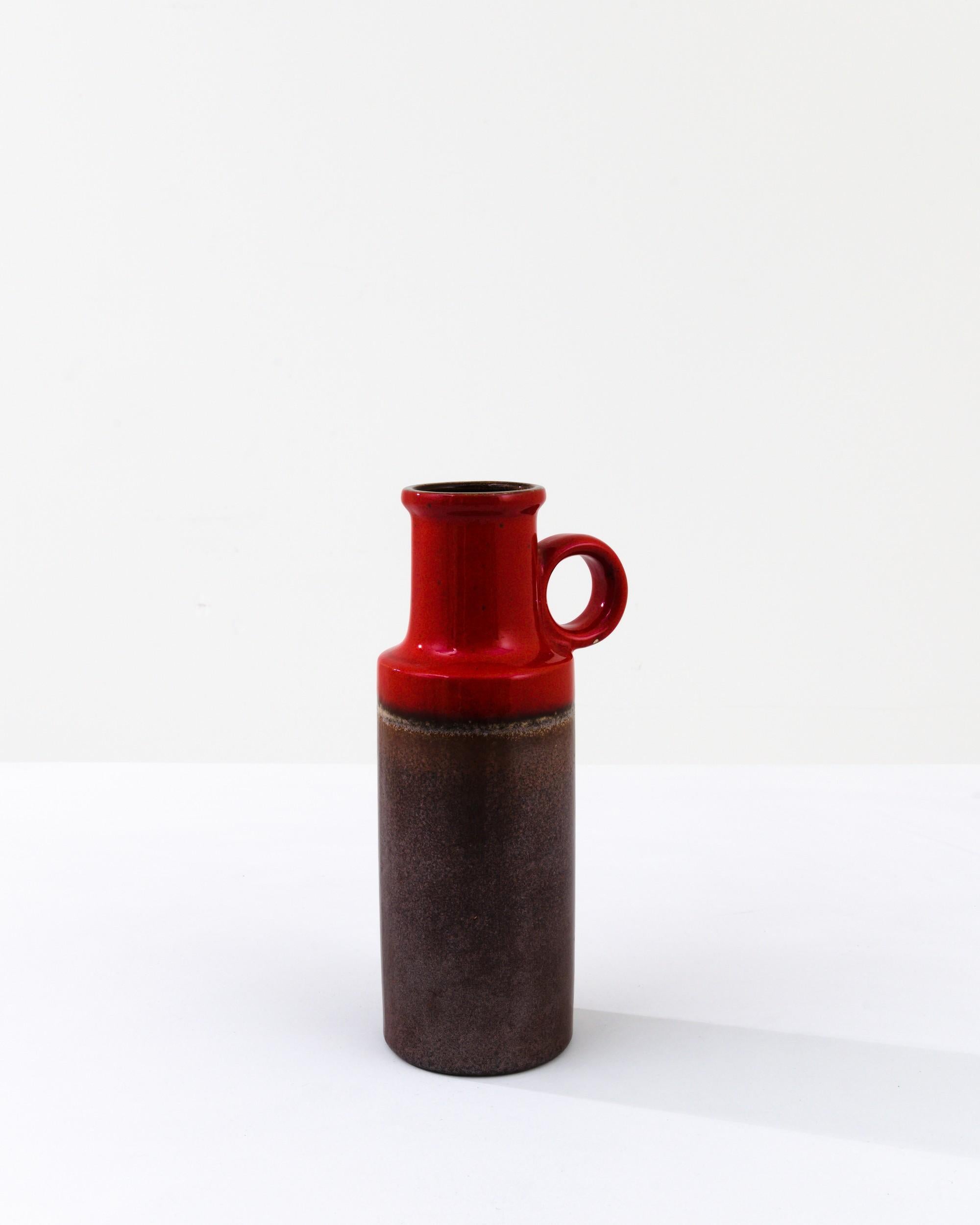 A ceramic vase from mid-20th century Germany. Neither large nor small, this studio made pot reflects the hand-held, and the handmade; the tactility of process and the artist's vision– realized on the potter’s wheel. A classic shape is enhanced by