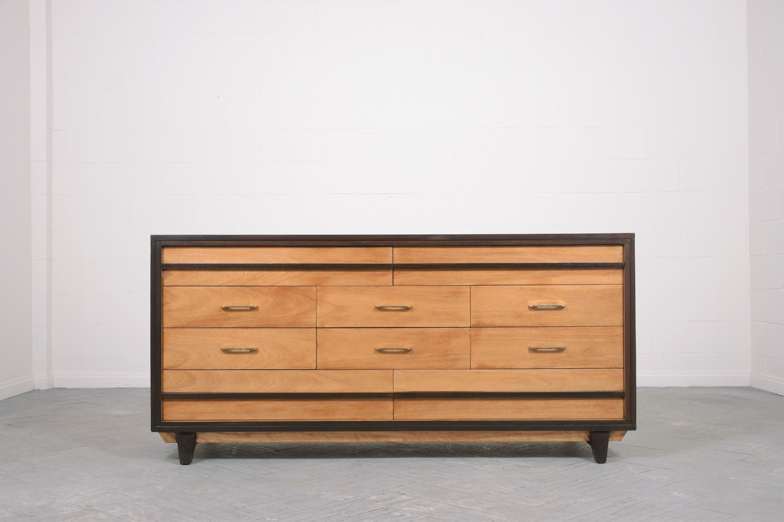 Elevate your interior decor with our stunning vintage mid-century modern walnut chest of drawers. This piece has been meticulously handcrafted from high-quality walnut wood and is in great condition, having been fully restored by our team of