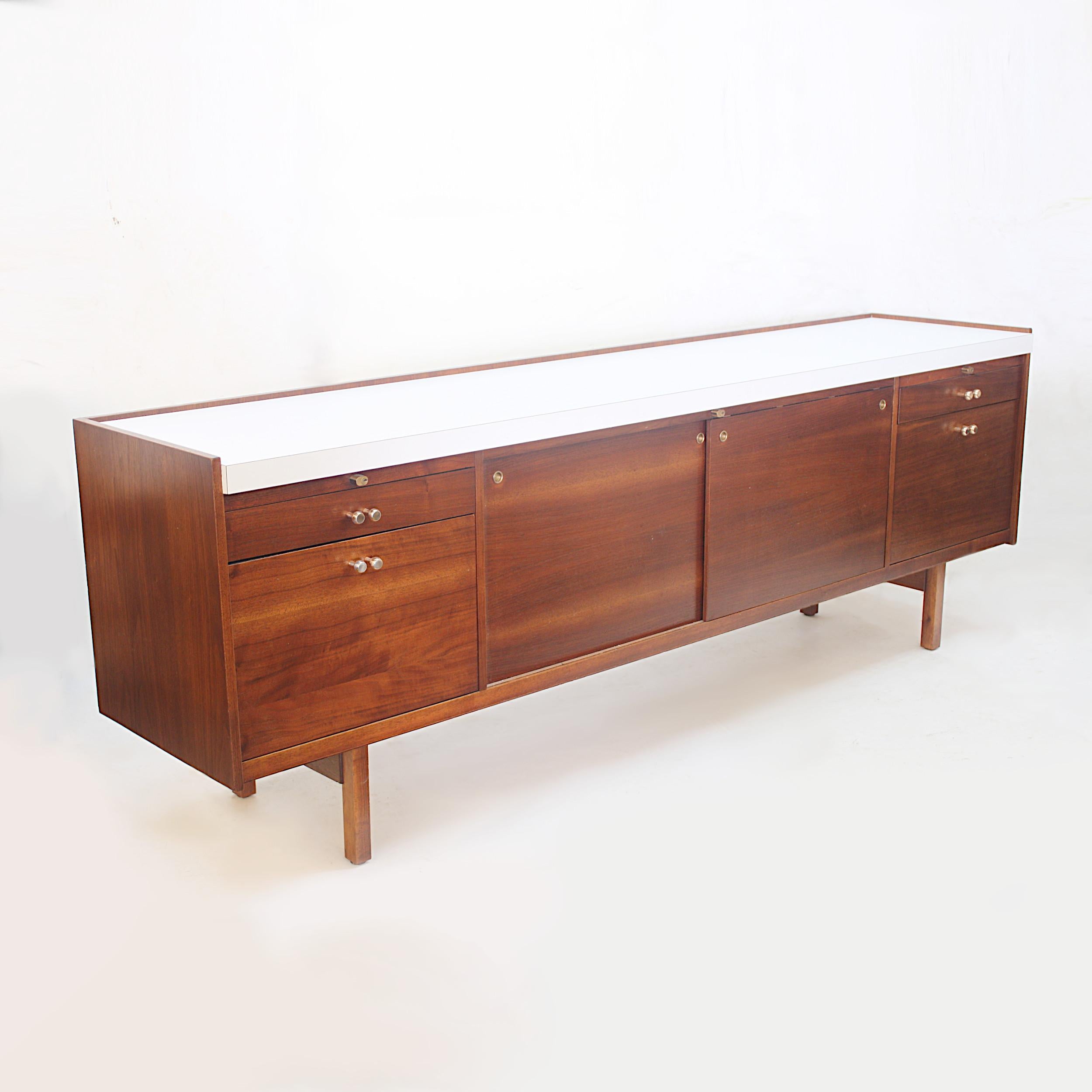 This amazing credenza is part of the Template Group series of furniture designed by architect/designer Charles Deaton for the Leopold furniture Company. Deaton is best known for designing the iconic 'Sculpture House' located on Genesee Mountain in