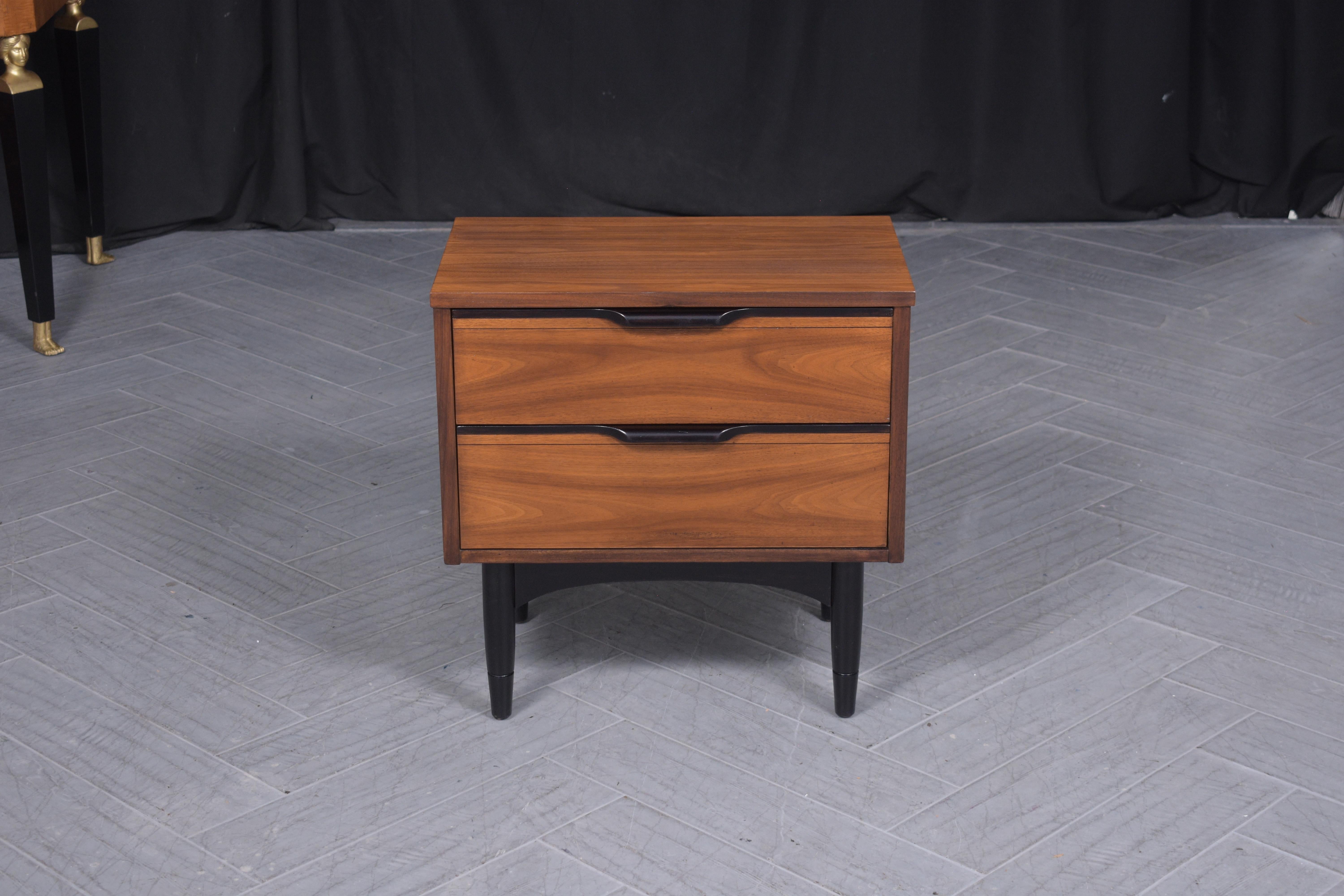 Dive into the classic 1960s with our meticulously restored mid-century modern nightstand, a fine exemplar of the period's design aesthetic. Hand-crafted from rich walnut wood, this nightstand showcases the craftsmanship and attention to detail