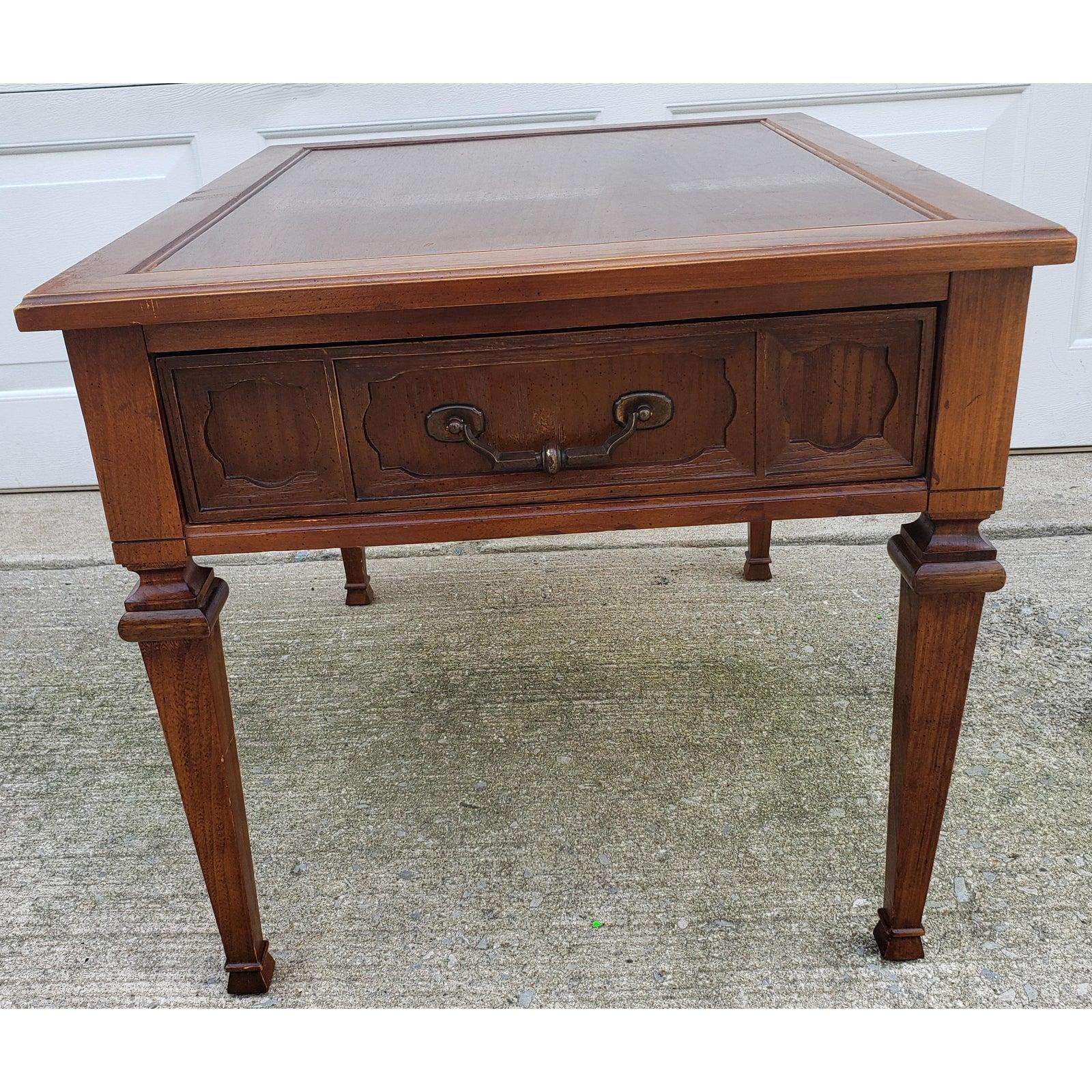 1967 walnut wood end table with with one drawer. It has the original brass handle. Table measures 22.5