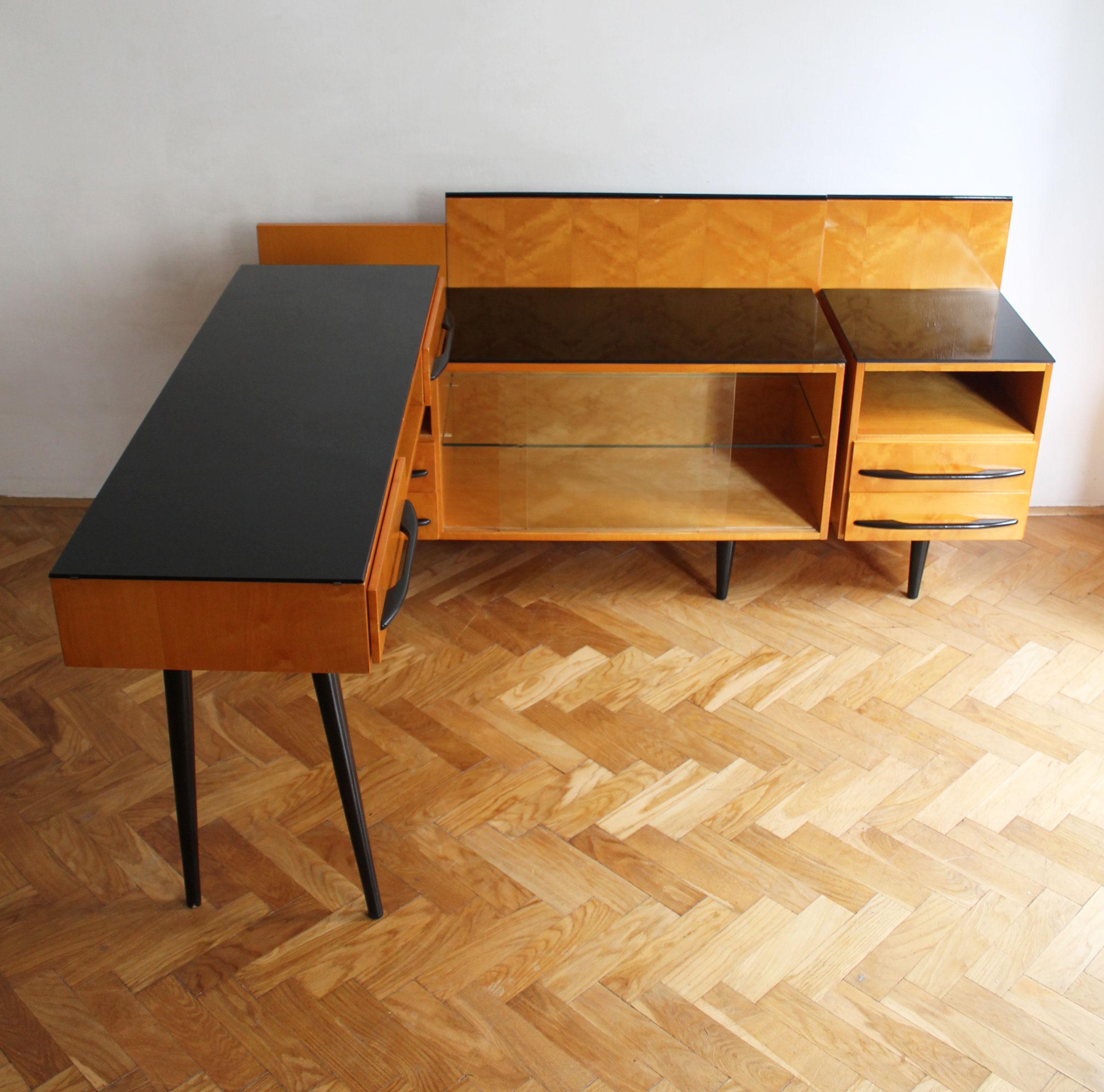 This Mid Century Modern Modular Set was designed by Mojmir Pozar and produced by UP Zavody, Bucovice factory in 1960’s Czechoslovakia.

This is a Modular set that consists of a writing desk, cabinet and side table.

All of these units work as
