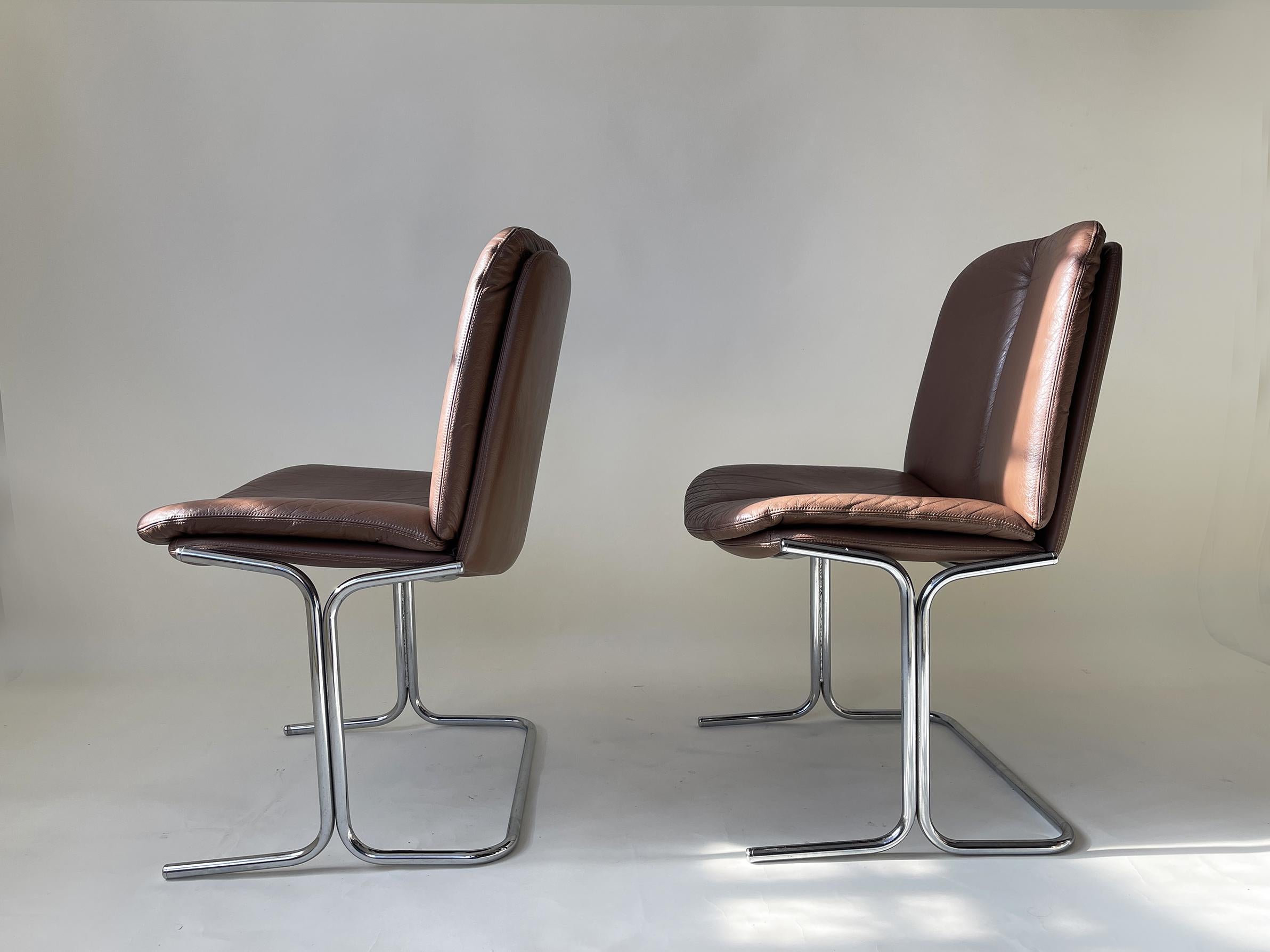 SET OF FOUR DINING CHAIRS IN AN AMAZING CHOCOLATE BROWN LEATHER BY ENGLISH FURNITURE MANUFACTURERS PIEFF. I ABSOLUTELY LOVE THESE CHAIRS, PERFECT AS DINING CHAIRS AND INCREDIBLY COMFORTABLE SEATS. 

* TIM BATES FOR PIEFF
* CIRCA 1970S
* ORIGINALLY