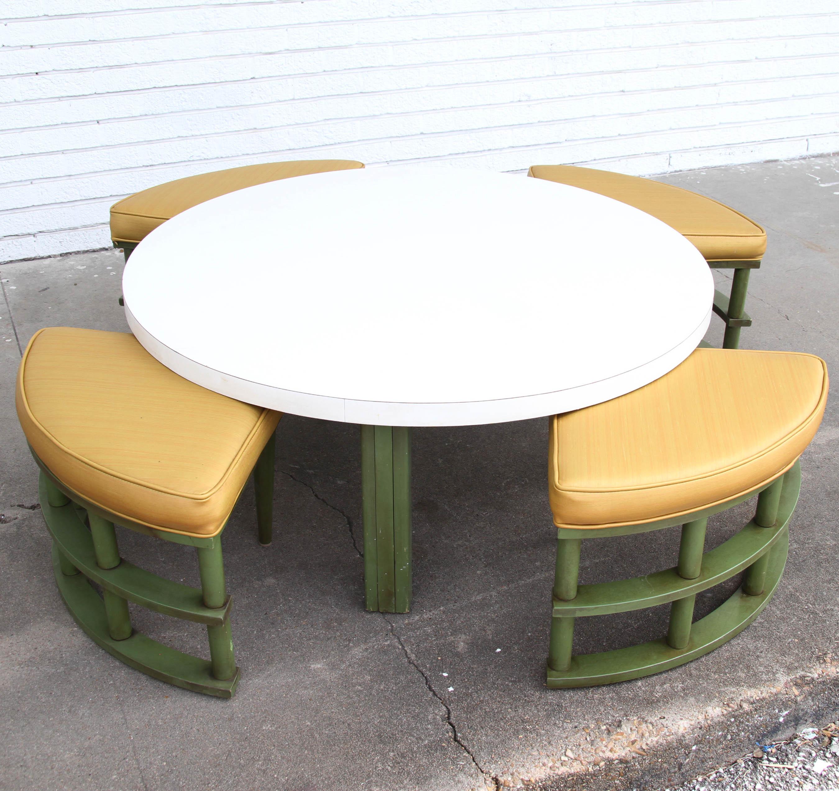 1960s Mid-century rattan adjustable dining/coffee table with seating
 

Adjustable rattan/bamboo table in a circular shape with triangular table seating. 
White laminate top with antique green base.
 

Dimensions:
Table: 41”W x 41