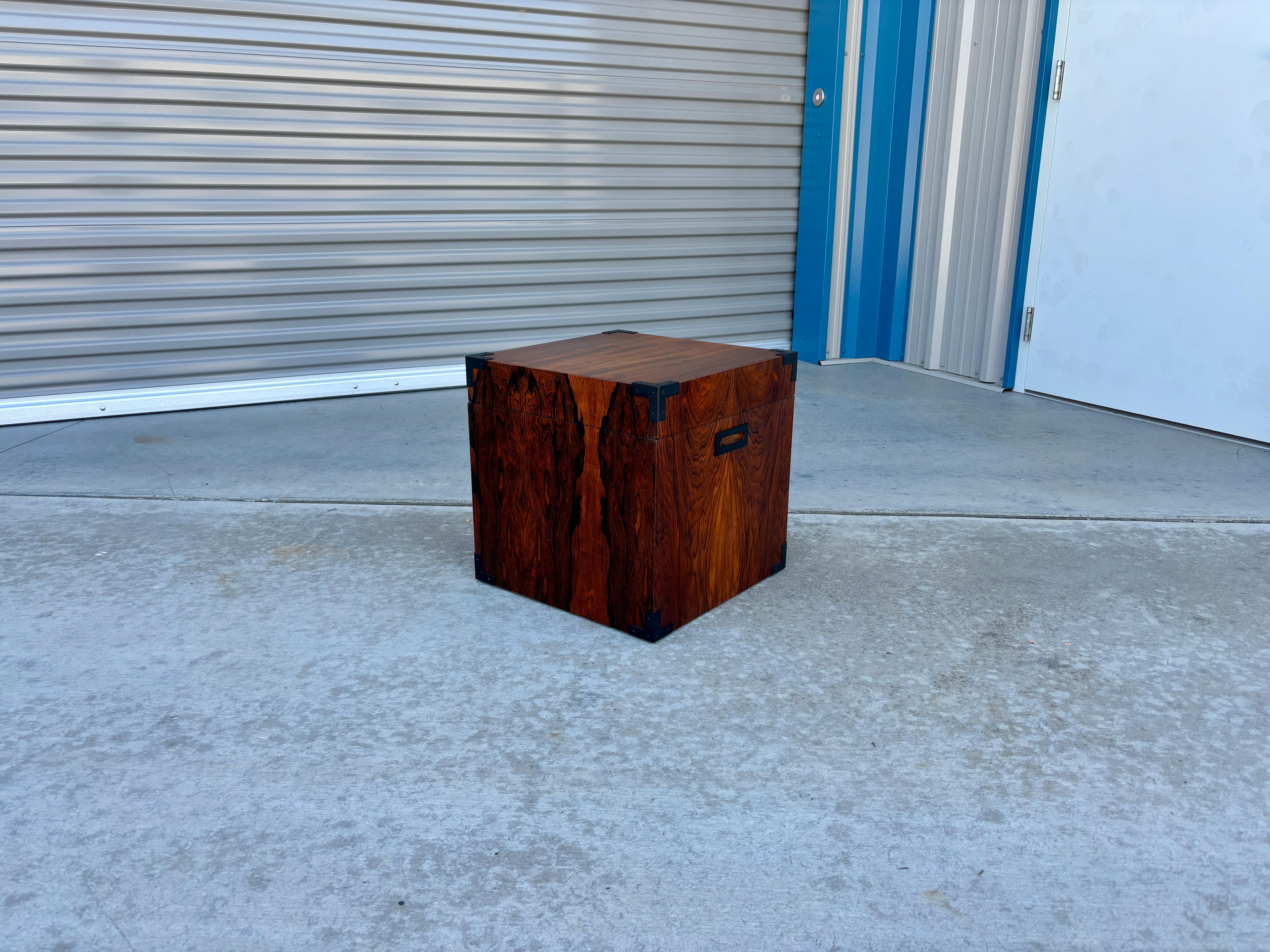 Welcome to Mid-Century NoHo

[Mid Century Rosewood Chest]

This mid-century rosewood chest is a beautiful example of American craftsmanship from the 1960s. The rich rosewood gives it a timeless appeal, while the black metal corners at every corner
