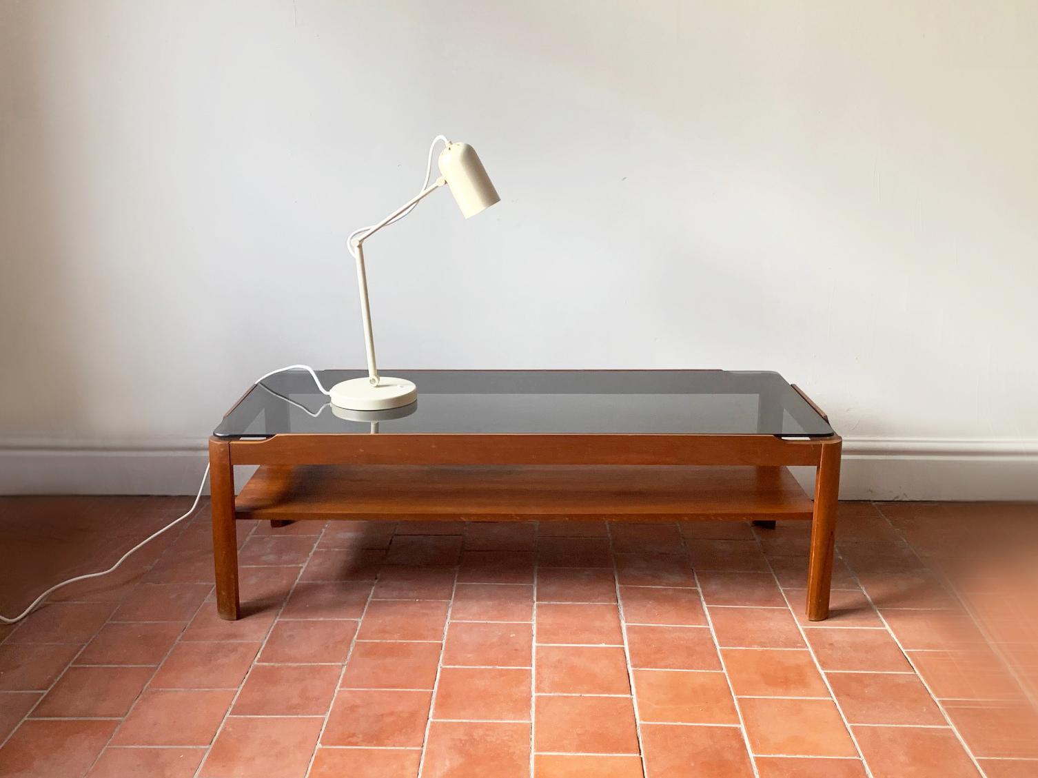 Mid century modern coffee table by respected English maker ‘Myer’. Solid countered teak frame with thick smoked glass insert

Size 
Width 112cm x depth 48cm x height 35cm

Condition:
Very good mid century condition. Minor signs of wear consistent