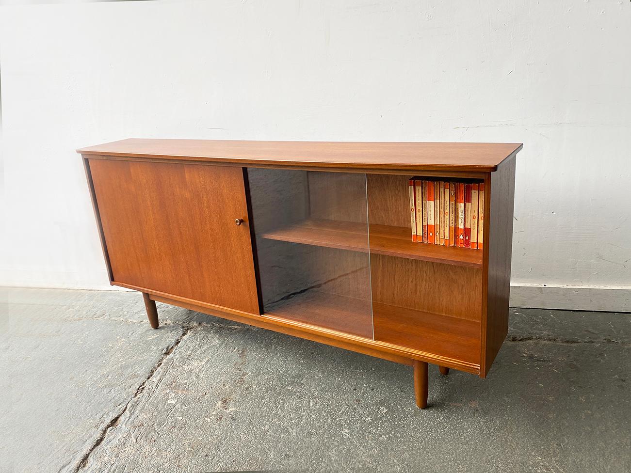 Glass 1960’s Mid-Century teak bookcase by Avalon For Sale