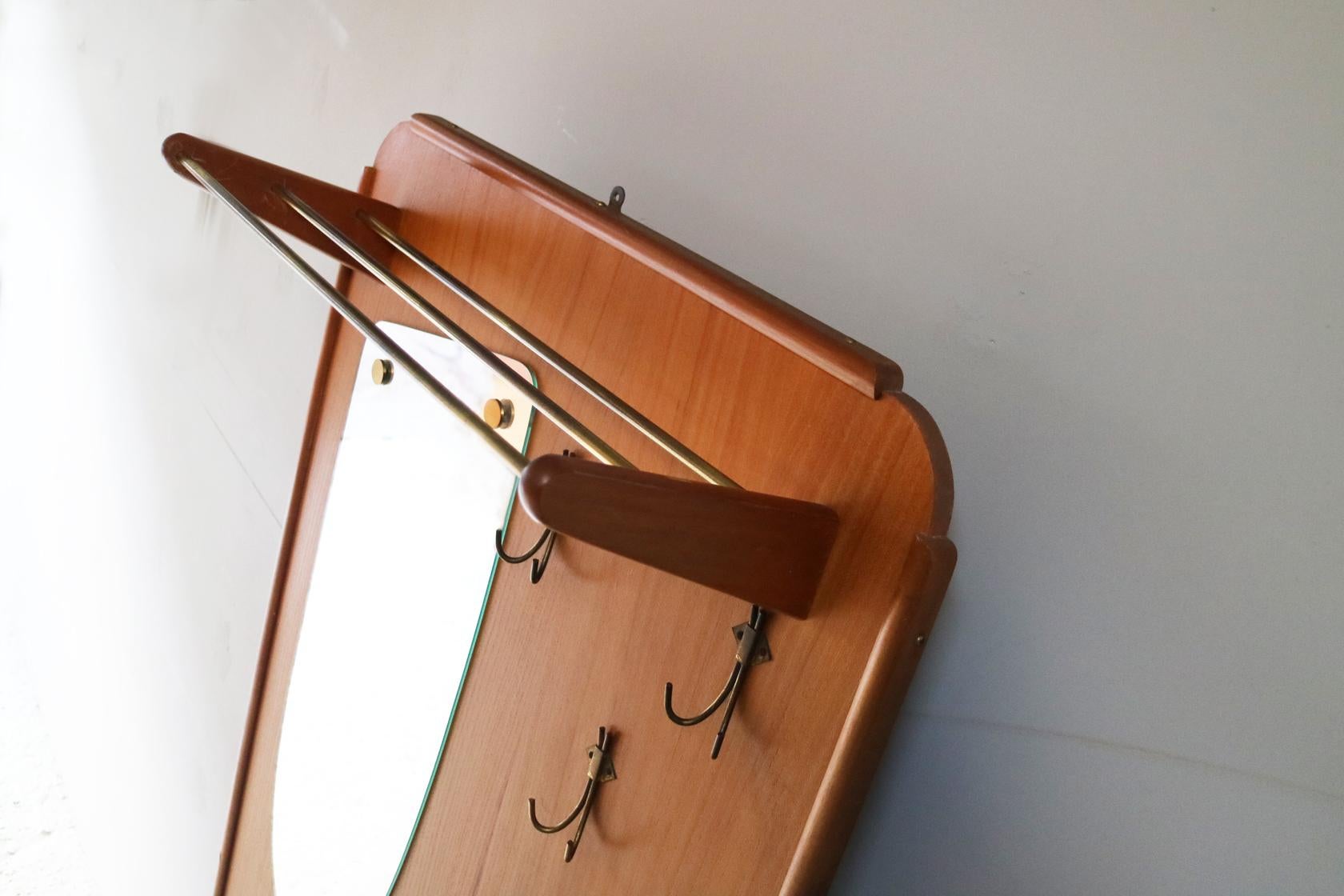 Free standing ‘hall stand’ with:
- Top hat rack
- Mirror
- Coat hooks
- Storage cupboard and drawer
- Umbrella stand.

Can be free standing or hung on the wall using eyelet. Lovely teak finish throughout. Petite brass handles.
 