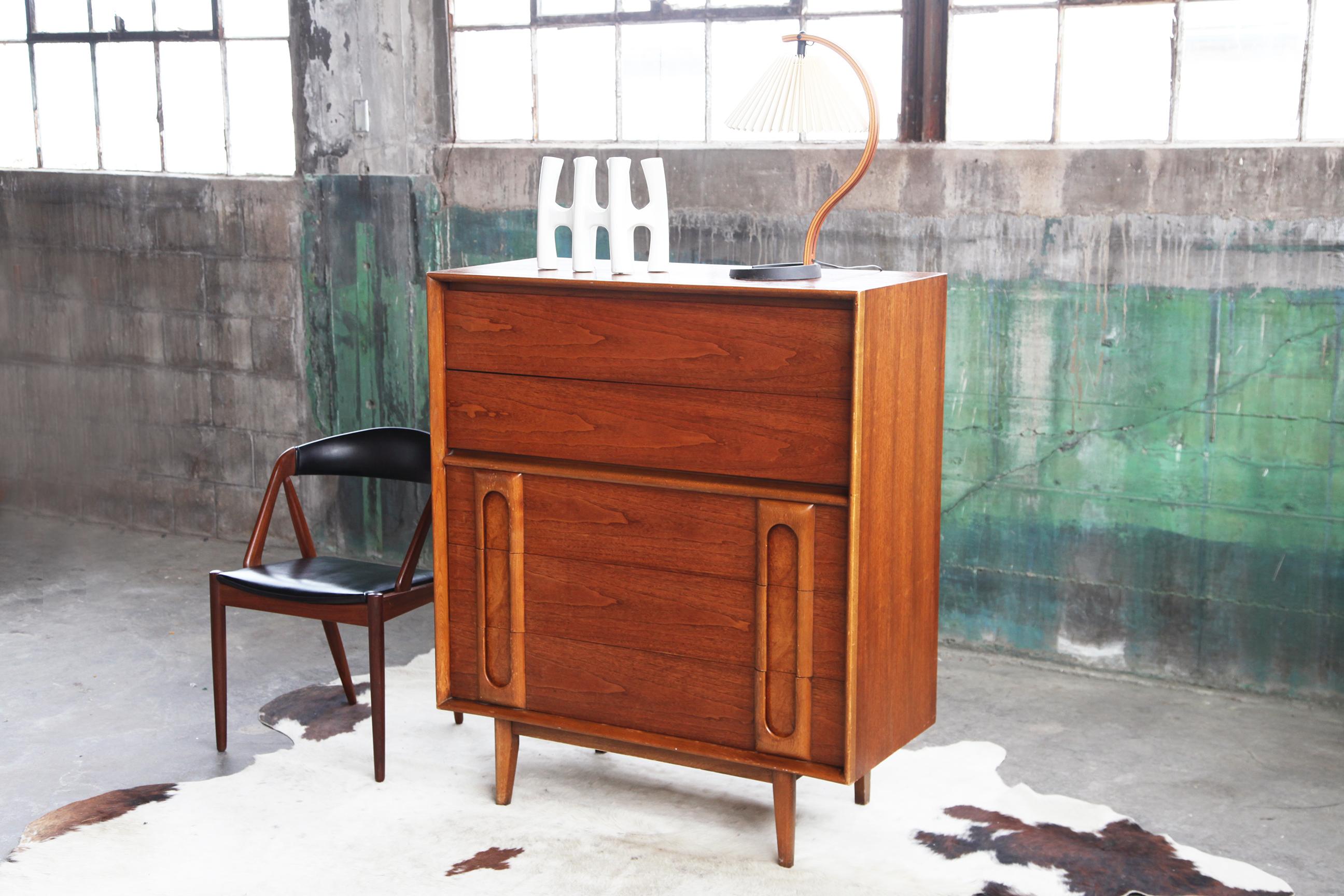 Ships from Madison WI USA warehouse.

This is a beautiful, top of the line, Original 1960's Lane Tall boy 5 drawer dresser. It features beautiful sculptural. hidden pulls, and it is easy to use them. This is just the kind of design we like to
