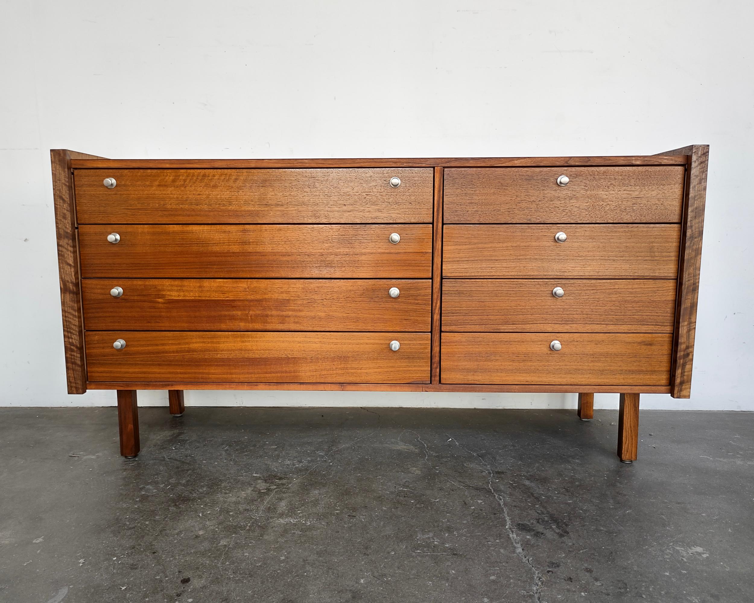 Unique walnut dresser by Martin Borenstein for Brown Saltman, circa 1960. Beautifully refinished walnut grain with original hardware. Matching small dresser in a separate listing. Overall great restored condition, there are some defects on the top