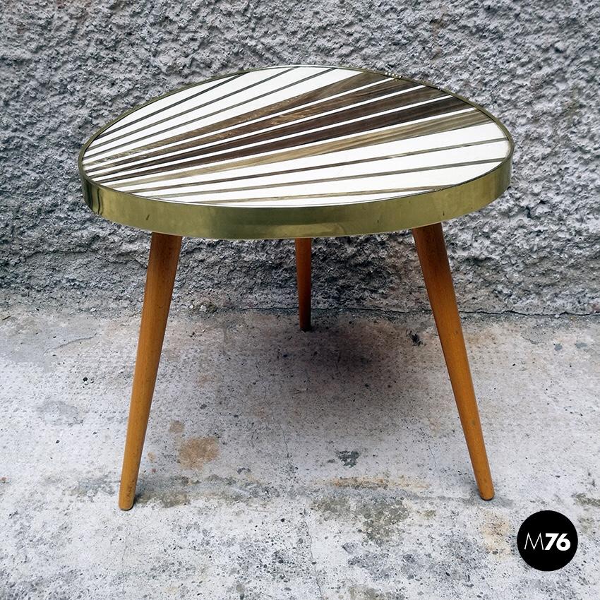 1960s midcentury German wood and beech coffee table
German coffee table with irregular shaped top with gold and white radial pattern and beech legs.