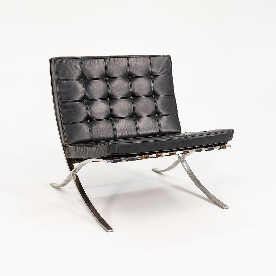 This is a 1960s vintage Barcelona chair in distressed black leather with a polished stainless frame by Mies van der Rohe and produced by Knoll. This example came directly from Gratz Industries and was in their private collection. Gratz Industries