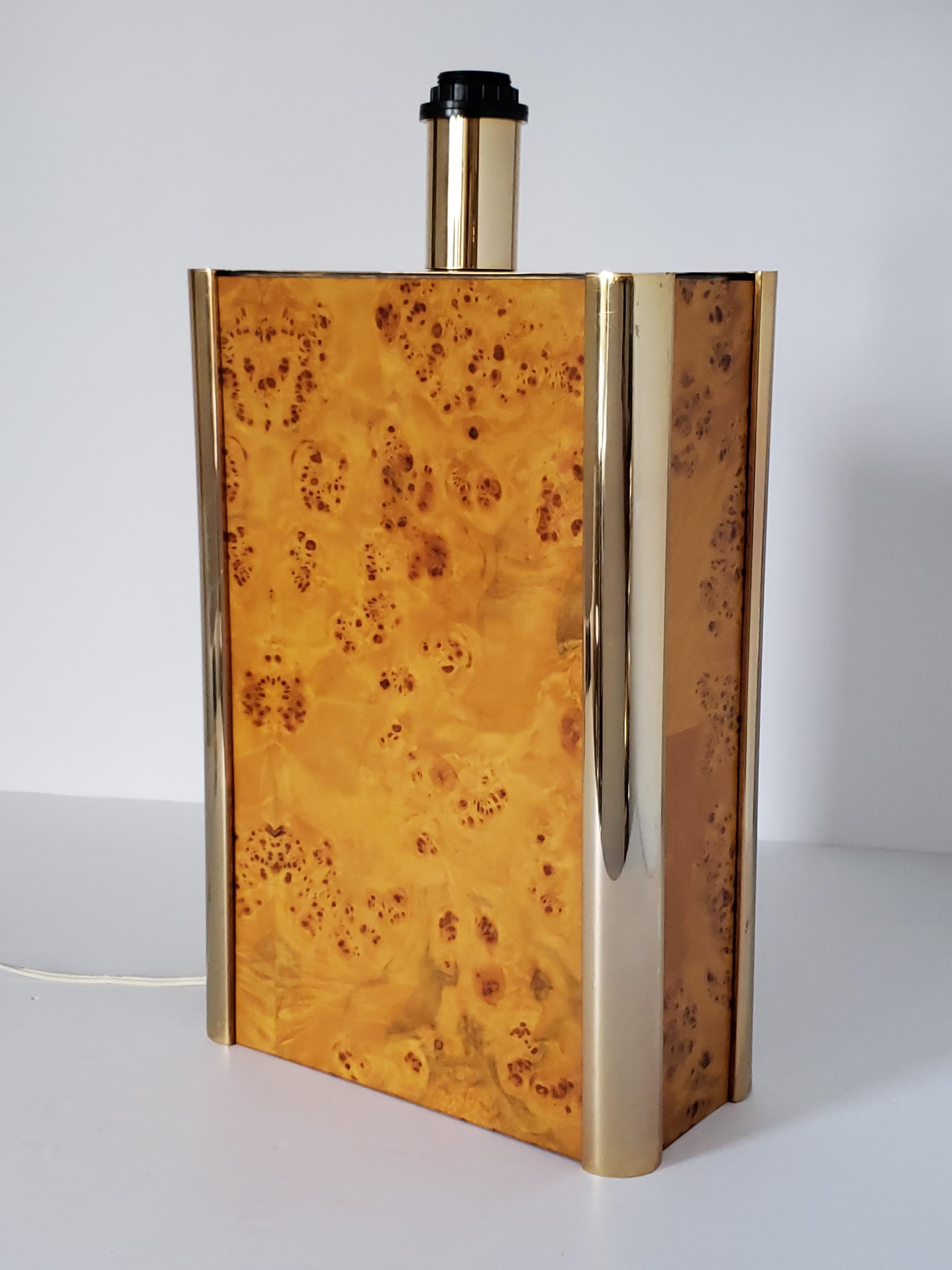 22 inches tall burl wood and brass table lamp.  

Contain one E26 socket rated at 100 watt.

Switch on cord. 

