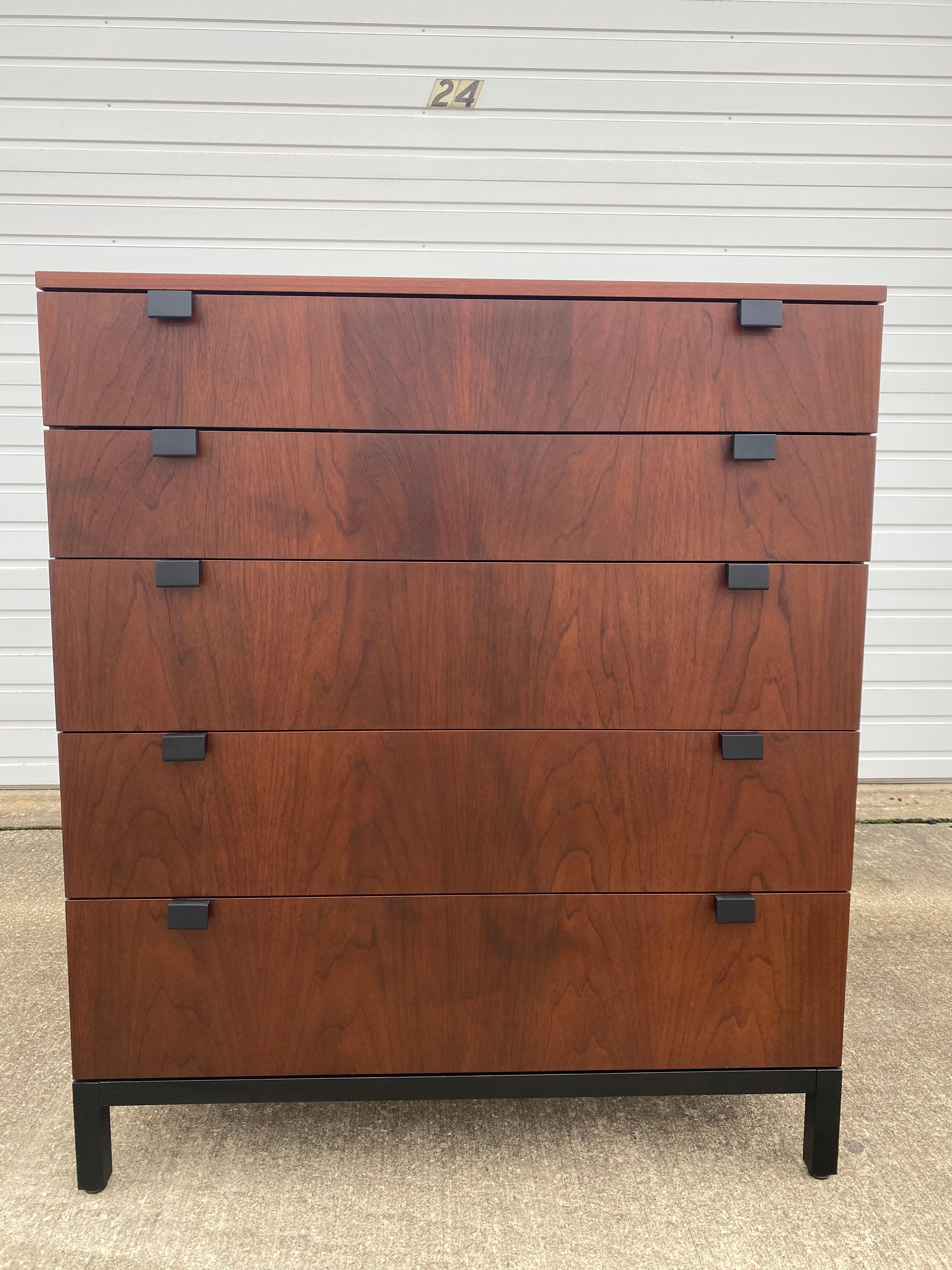 A Modern tallboy dresser designed by Milo Baughman for Directional from the Gallery I Collection, circa 1963 has been partially refinished to show off its beautiful walnut wood and new black lacquer on its handles and legs. This tallboy dresser has