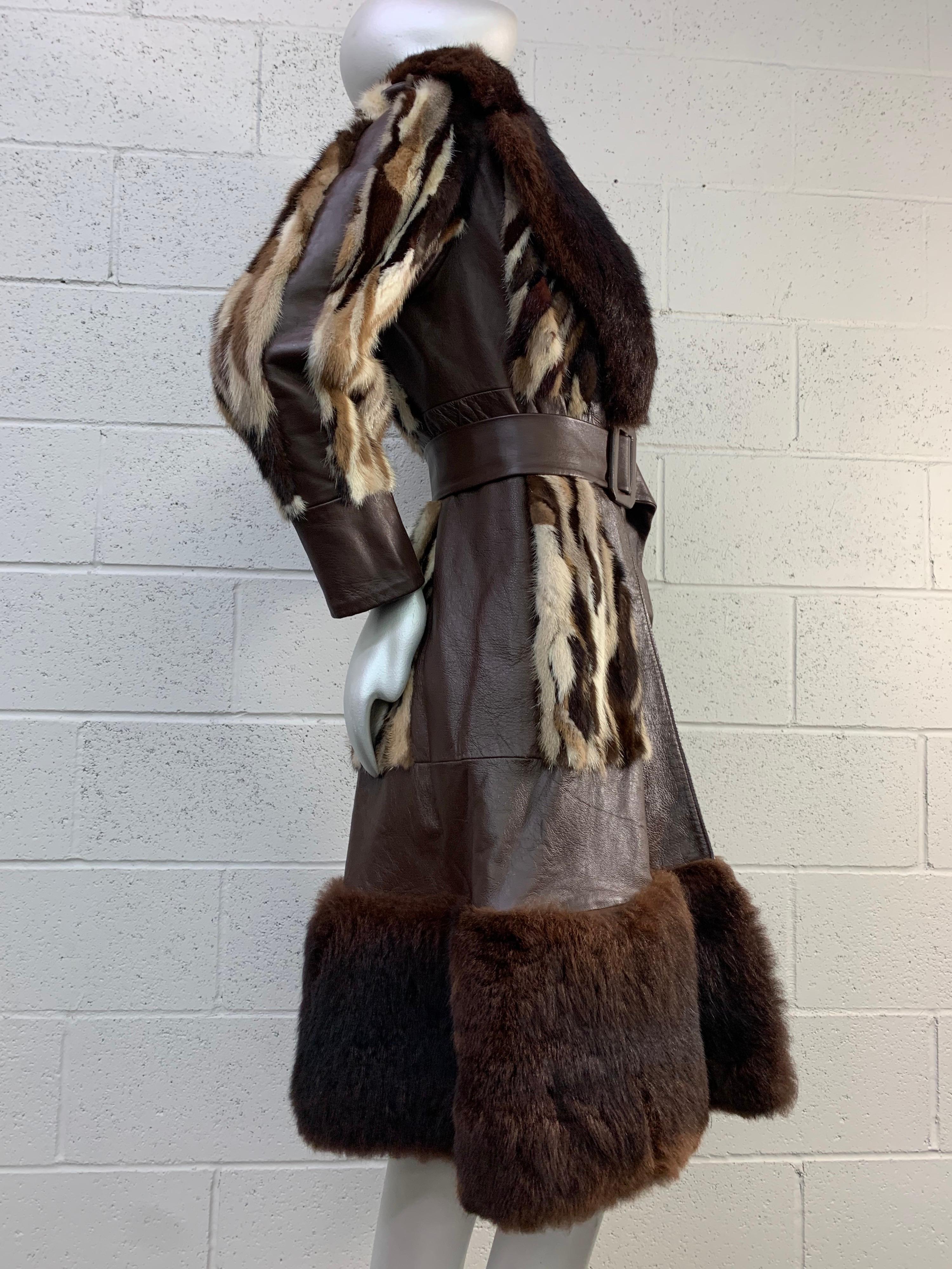 A fabulous 1960s foxy cool fit and flared coat in various natural color mink patchwork, leather and muskrat trimmed wide notched collar. Original belt included. Fully lined. Heritage brand label. Size 8. 