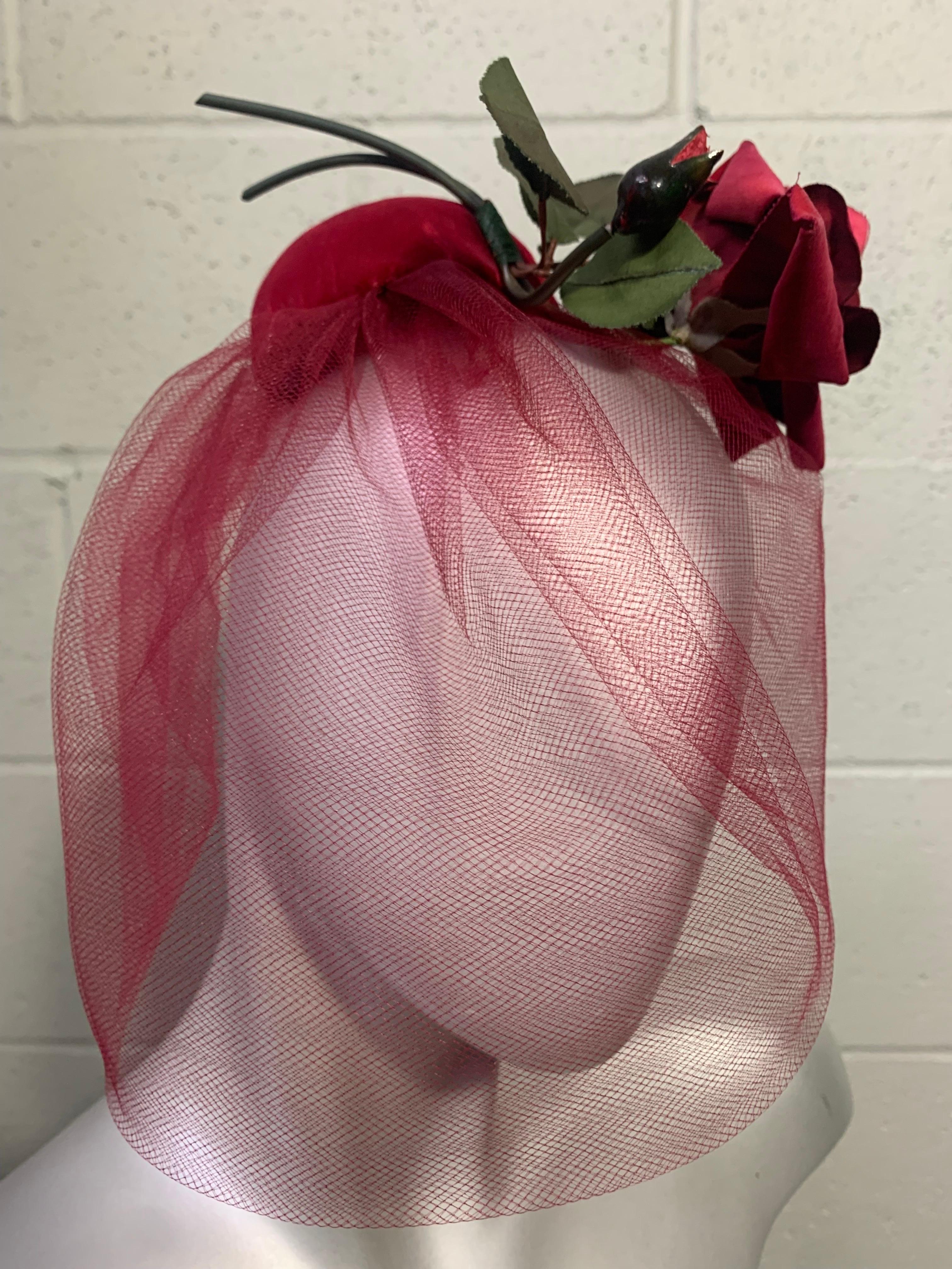 1960s Miss Sally Victor Diminutive Fuchsia Velvet Pillbox Hat with Tulle Veil and Full Stemmed Rose:  An striking and iconic design from a preeminent milliner. One size fits all with original combs included for securing 