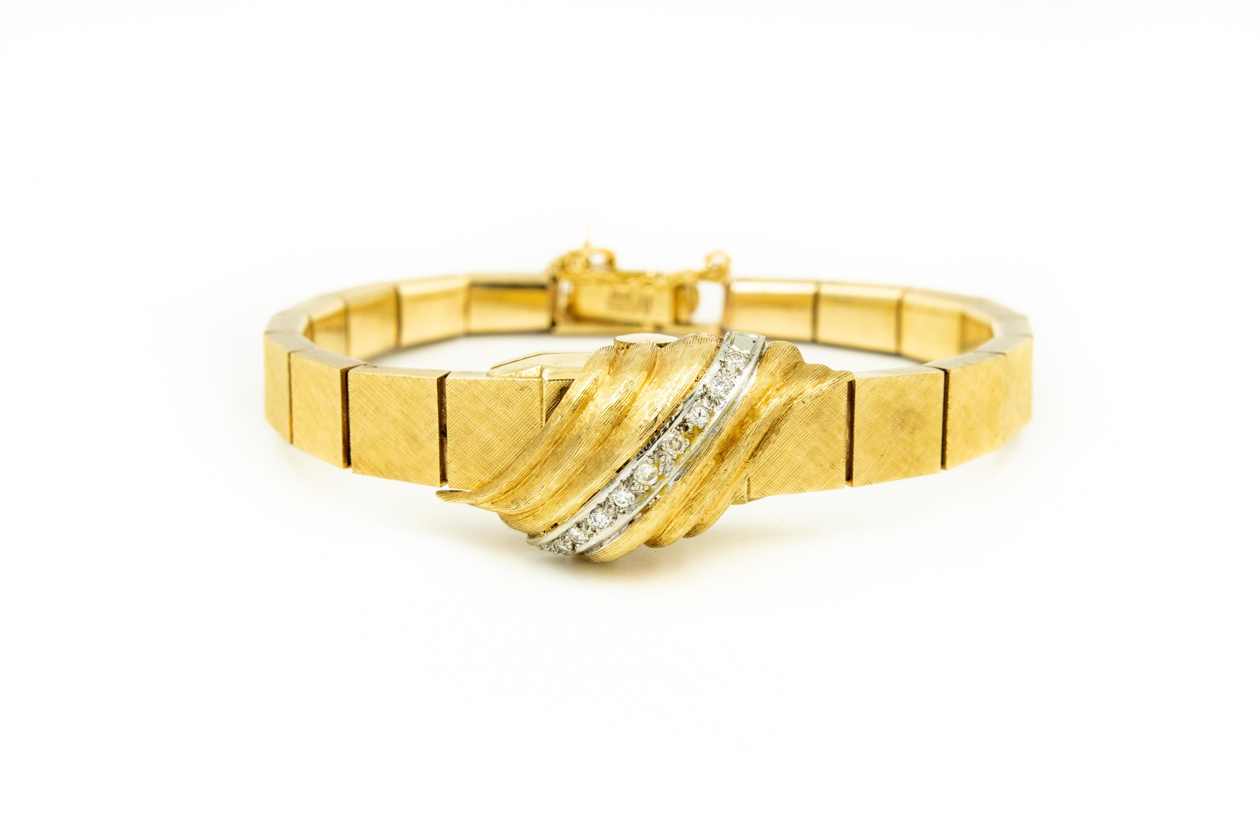 Mid 20th century 14k yellow gold watch with a diagonal row of 9 x .01 c. each single cut diamonds for an approximate total weight of  .09 carats.  The cover hinges up to reveal the time.  It has a mechanical movement which means you mush wind it