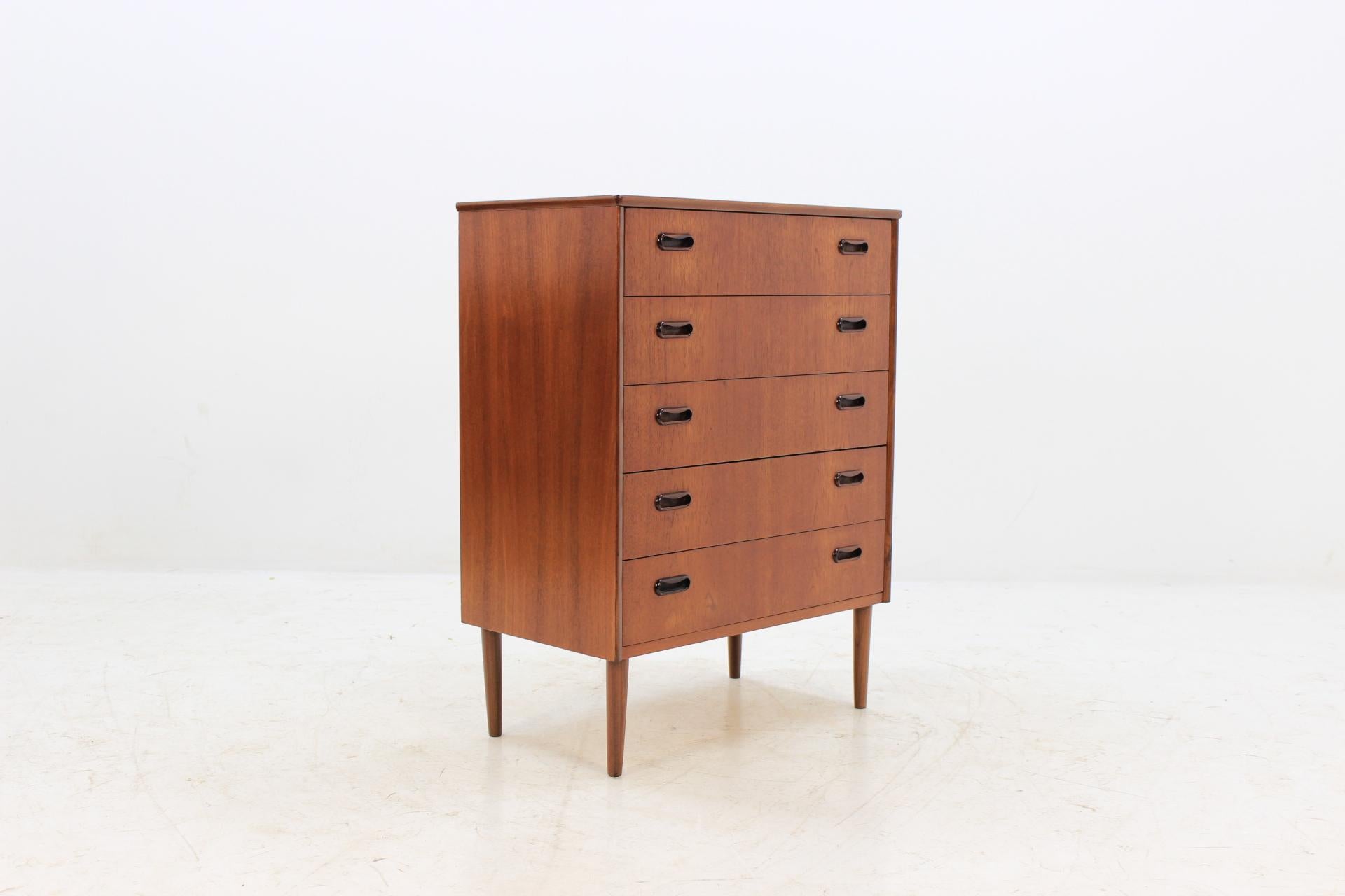 This commode features five drawers. The item was refurbished.