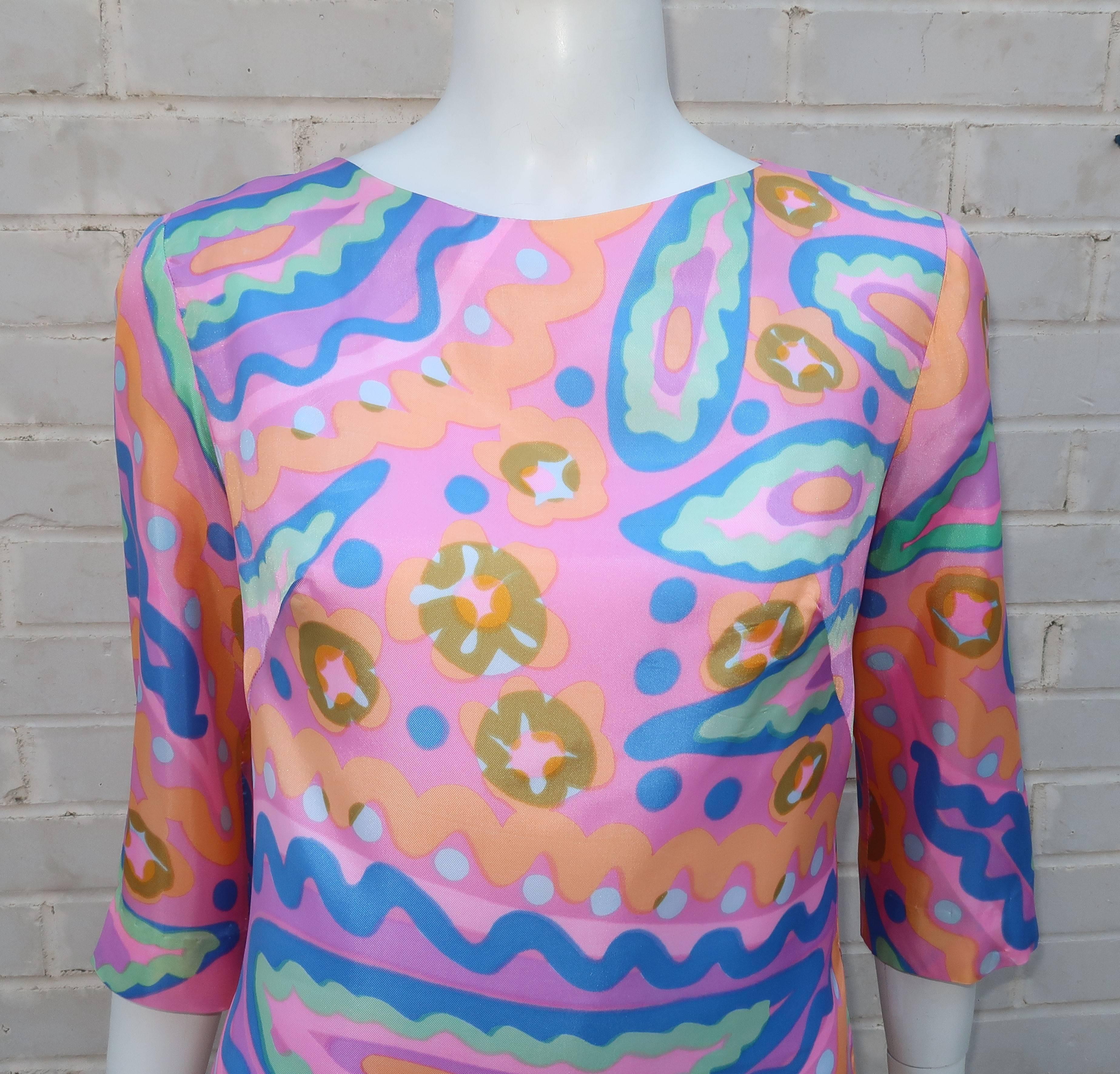 The easy California lifestyle and look of the 1960's is epitomized in Alex Colman's cropped top in candy colors and a mod print.  The silhouette is designed to fit across the shoulders with a free flowing bodice accentuated by rounded side vents and