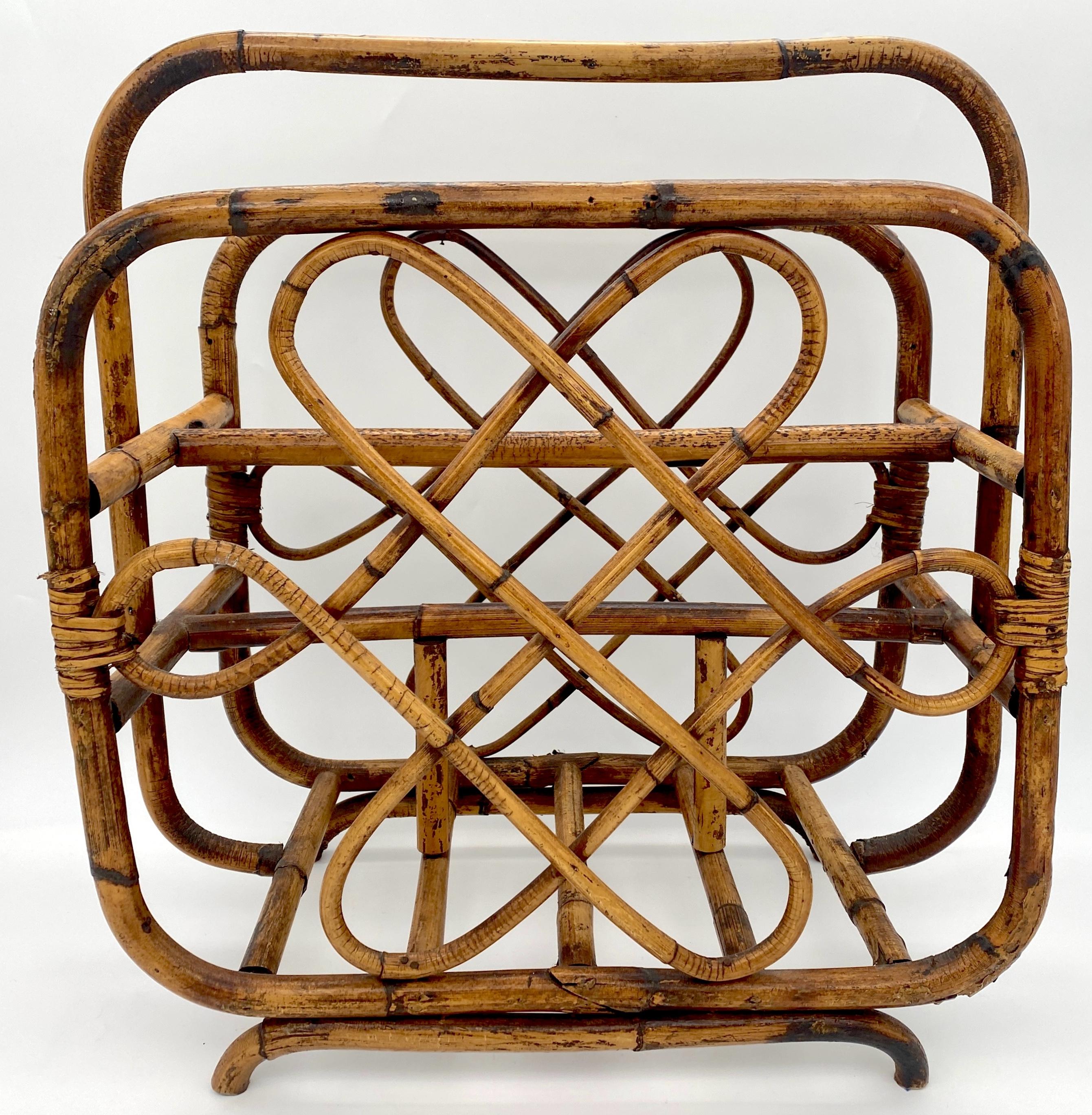 1960s Mod Sculptural Bamboo Magazine Rack/Stand 
USA, circa 1960s 

Add 1960s Mod era charm to your space with this captivating sculptural bamboo magazine rack/stand from the USA, crafted around the 1960s. Standing at 19.5 inches high, 18 inches