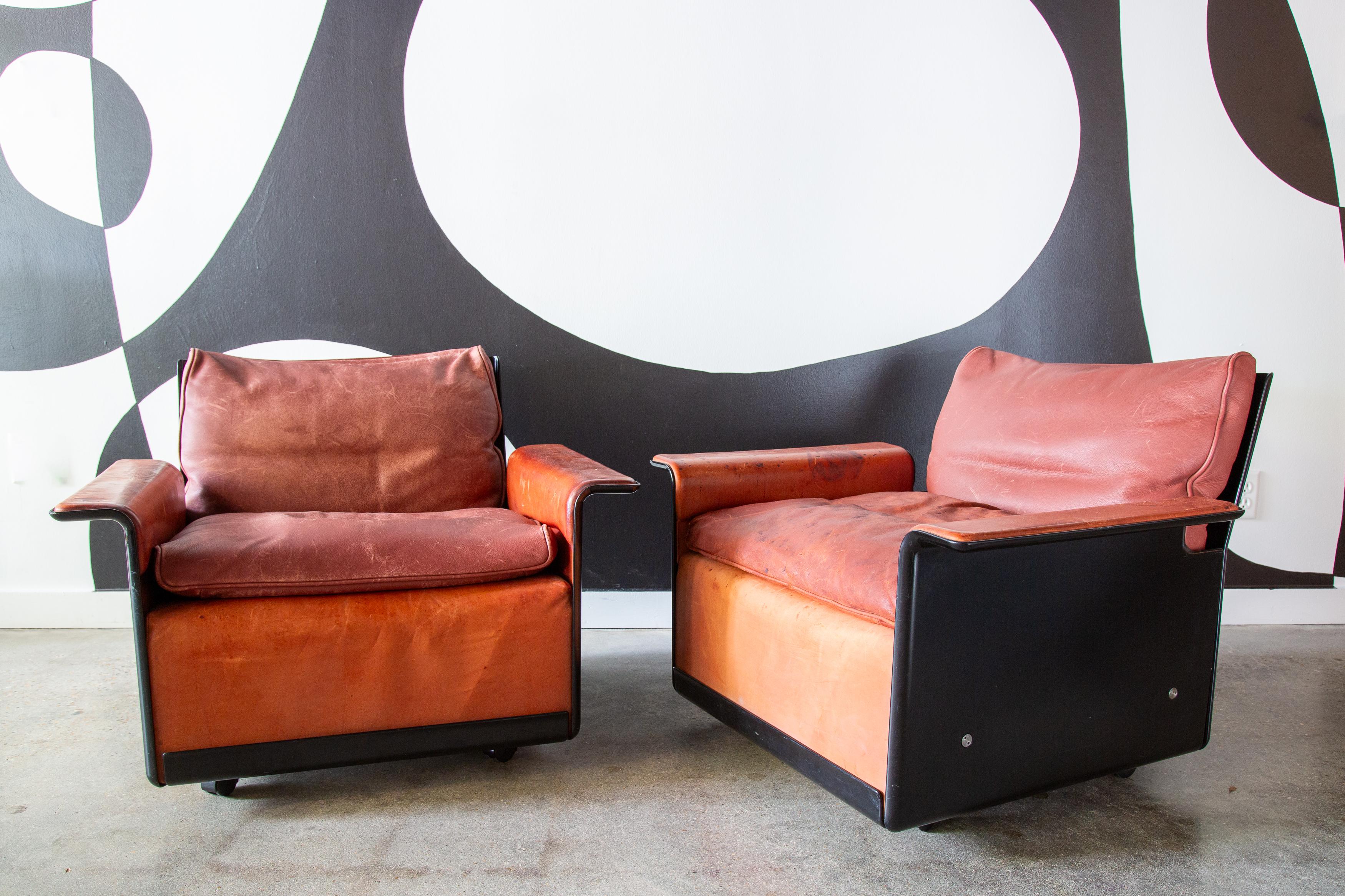 A pair of lounge chairs in fiberglass and cognac leather. Designed by renowned industrial designer Dieter Rams for Vitsoe, these model 620 chairs are as timeless as they come.

When most people think about Dieter Rams, they think about the iconic