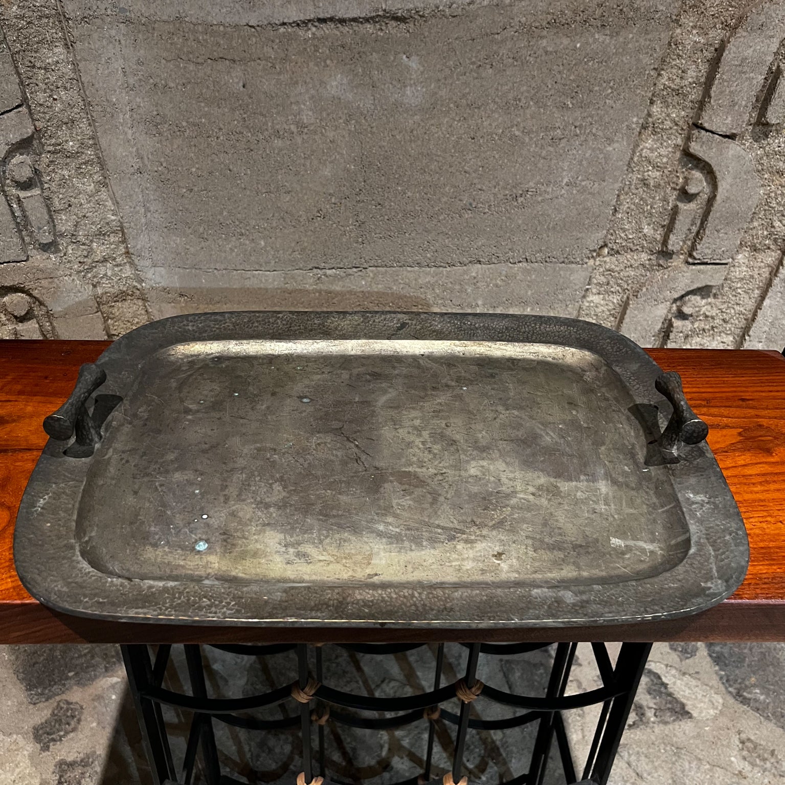 1960s Modern elegance hand hammered silver service tray from Mexico

 Mexico 1960s vintage serving tray with beautiful handles.
 Rectangular shape rounded corners.
Measures: 2.5 tall x 21.25 x 15.5
Unmarked.
Vintage unrestored finish. It