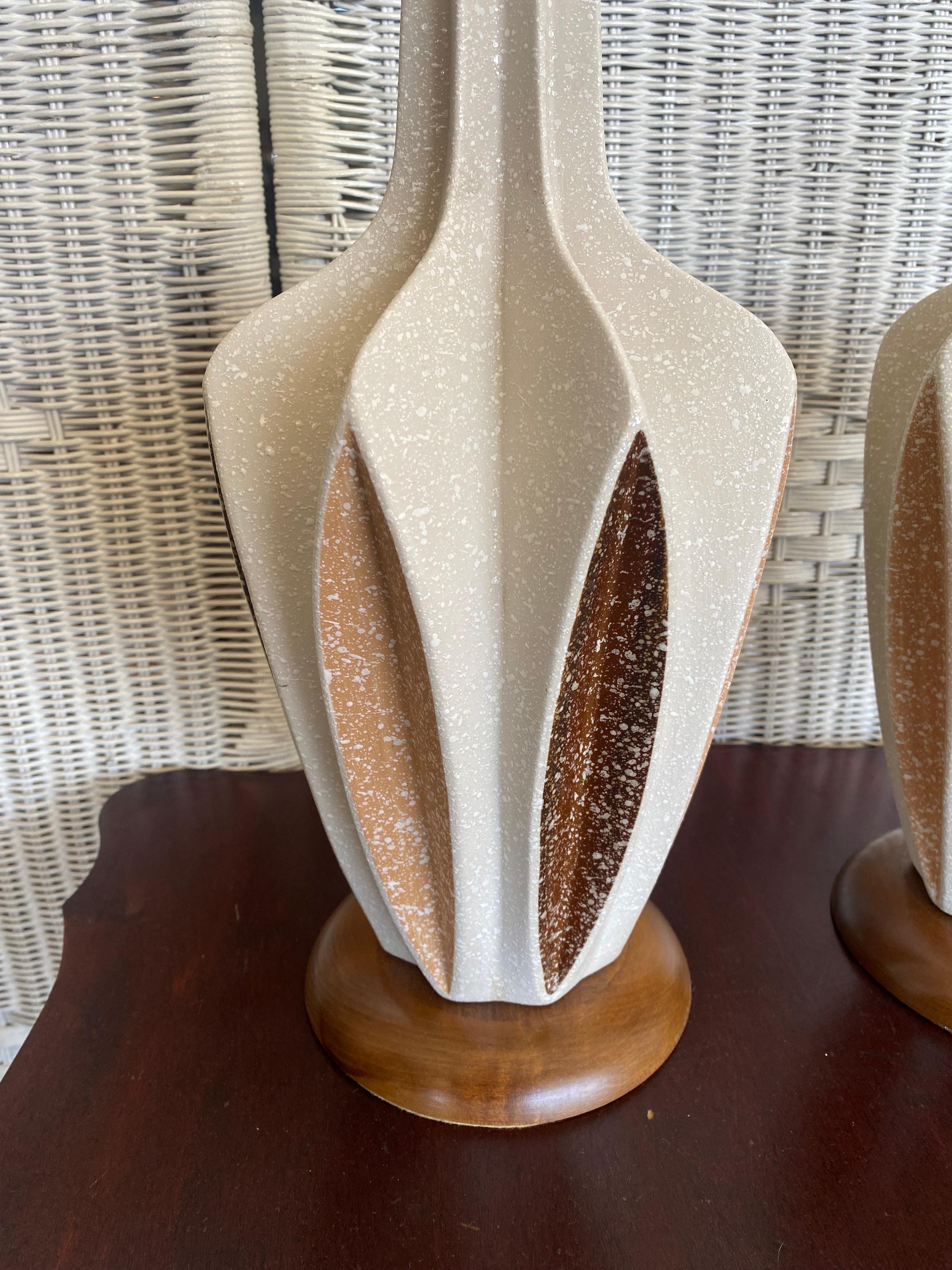 Beautiful and large pair of 1960s Modern Italian ceramic table lamps. This lamps stands out in a few different ways. First there's the off white or beige large body with 2 tones of brown, mocha and coffee to be more specific, as prominent accent
