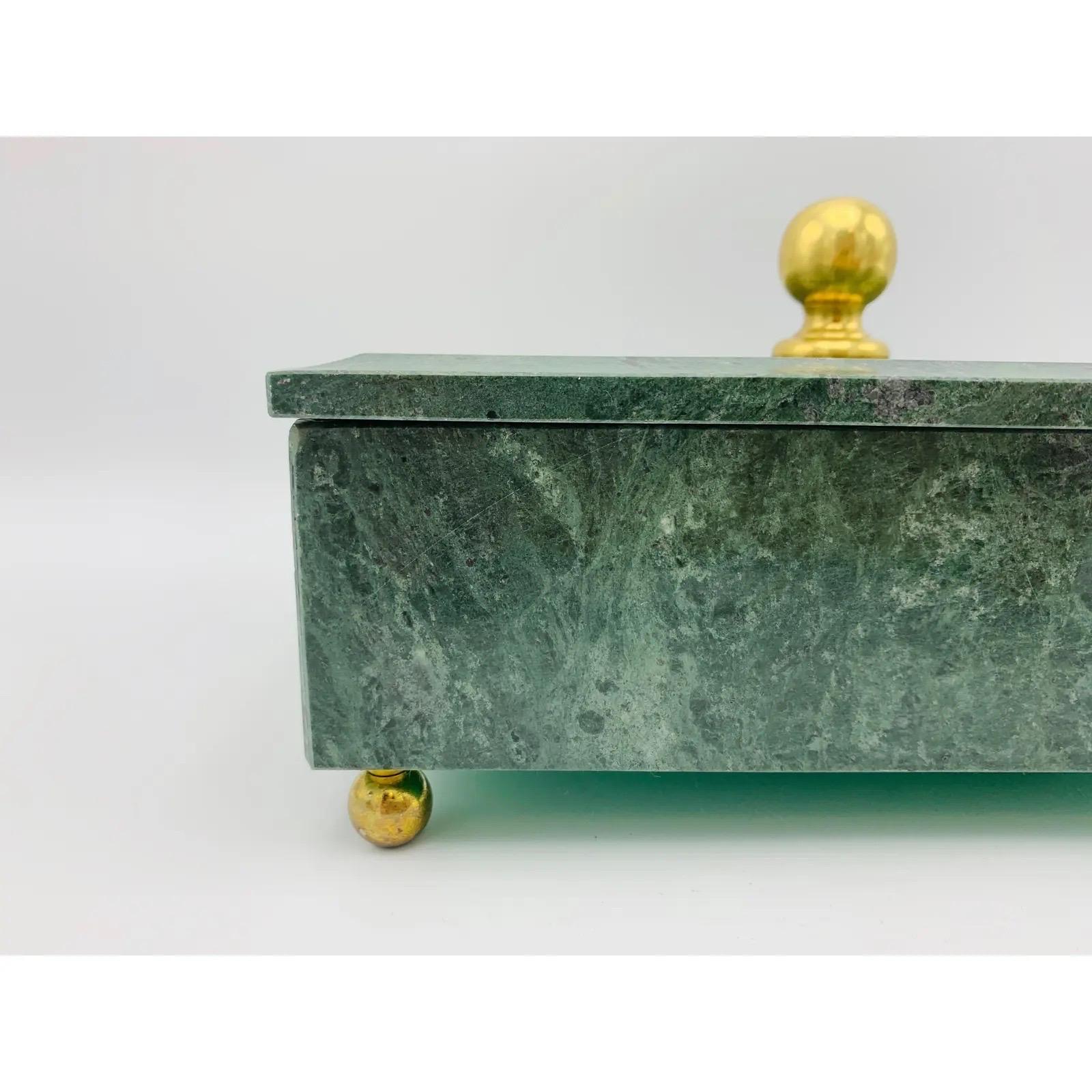 Listed is a stunning, 1960s Italian marble and brass footed box. The piece has small, polished solid-brass balled feet at each corner with a larger, ball on the lid. Incredibly heavy for its size, weighing 4.2lbs.

Dimensions:
Interior: 1.88