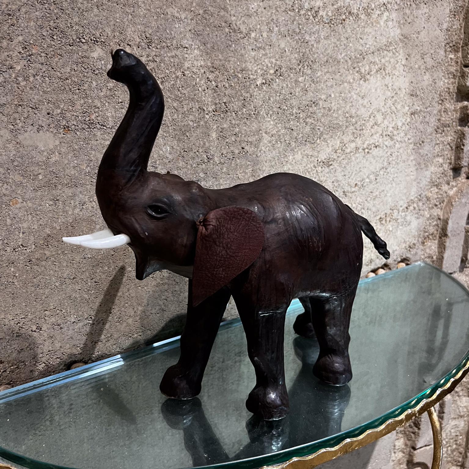 Midcentury Modern Leather Elephant Table Sculpture
13.5 d x 13.25 tall x 4.75 w
Original vintage unrestored condition
See all images provided.